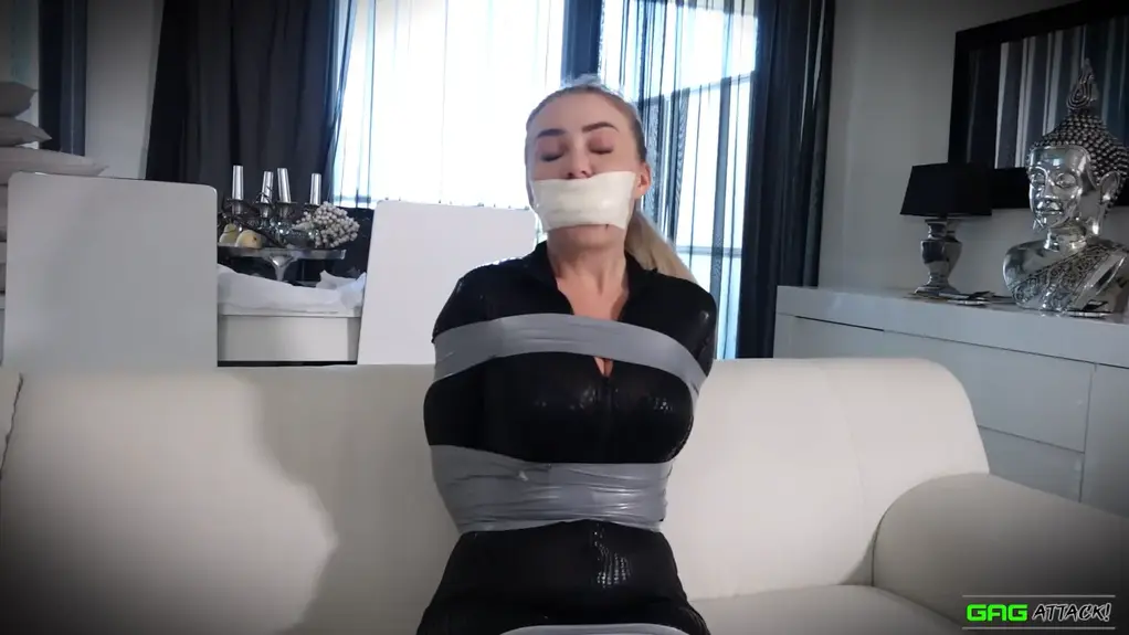 Aubrey - Multiple Gags While Wearing Catsuit FULL 4 Gag Video HD Featuring Aubrey Gag 1 Aubrey is tightly and inescapably tape bound in a catsuit, with a series of gags stifling her protests... A barefoot and ponytailed Aubrey, dressed in a figure-hugging catsuit, has been securely bound, with many strips of silver tape above and below her breasts, pinning her arms to her body, and more tape wrapped around her thighs and calves. She is immediately gagged,...