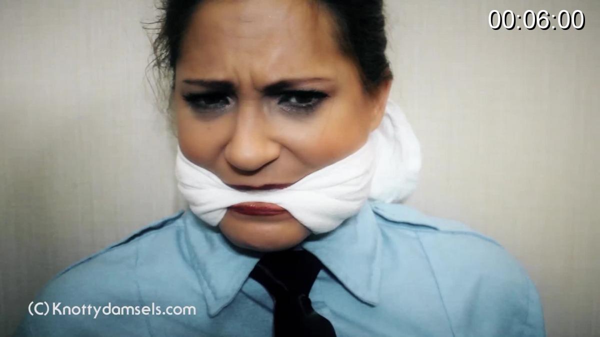 Vivian Ireene Pierce: The 2021 Sessions If anyone can play DiD in any role, it is the incredibly talented and stunning Vivian Ireene Pierce, and this compilation proves it.<br><br>First off, VIP is a uniformed cop who is caught while tailing a suspect. She is cuffed with her own handcuffs, feet bound with rope, and cleave gagged with a white cloth.<br><br>Then, VIP is in a beautiful evening dress and is planning a robbery, but in order to do so she must be tied up as to not be considered part of it. She is tied heavily to a chair and enjoys it, but feels that in order for her to really be in trouble, she must be gagged, so she is cleave gagged with a white cloth. At first she struggles playfully and then realizes that she is being doublecrossed. She is left trussed up and gagged while her partner runs off with the money she spent months trying to secure.<br><br>Next up, VIP is robbed while on vacation in a sweater. She is bound and OTM gagged with a white cloth, stashed away in a small closet left to struggle and moan, as best as VIP can.<br><br>VIP captures the look of a southern belle perfectly in a print flower dress while in a kinky roleplay with her boyfriend. She is bound hands and feet and tape gagged with a simple strip of white tape. Her boyfriend leaves and she is happy to be tied up. Then, her brother shows up and makes matters worse, thinking she really was captured.<br><br>Finally, heiress VIP is held for ransom. She is bound hands behind and cleave gagged with a knotted red bandanna. She tries to flirt with her captor through the gag and succeeds in him removing it. Then, VIP shows her wits and ability to adapt to any dangerous situation by outsmarting her captor.<br><br>In all my years of shooting, there are few who enjoy pure DiD bondage like Vivian Ireene Pierce and this collection proves that she is one of the best there is today.