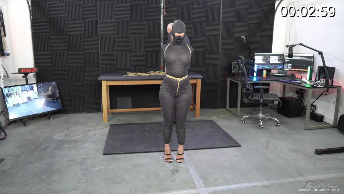 Doing My Thing Martin got me a new catsuit with a hood and I couldn't wait to wear it for the show. He was thrilled when I tried it on for him and he knew instantly, what he was going to do to me in this outfit. I gagged and hooded myself first and Martin did the rest. Beginning with a crotch rope to punish my pussy since he can't get to it, then my elbows. Wrists and crotch rope secured to the ceiling, ankles tied and the dance of discomfort begins. It's a real fight having to turn in place in a strappado but I love-hated it so much that I even asked for a pony tail to my elbows. I must love the struggle... besides, it's what I do best :)