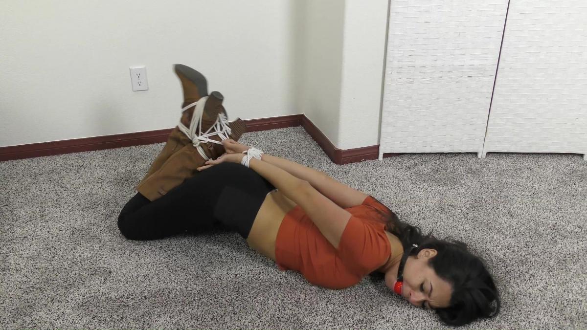 QT0954 Kristen Moore (is-qt-km047) Model(s): Kristen Moore<br>Video Clip Length: 12:30 minutes<br>Video Format: MP4 1920x1080 14000kbps<br><br>Kristen Moore pretends to be a young, eager reporter in order to land an interview with a highly successful female executive. But she is really trying to break a story on the company’s illegal activities. Of course, she gets caught and ends up tightly hogtied and ball gagged – rolling around on the office floor. Kristen looks great in her tight leggings, boots and sexy crop top. 
