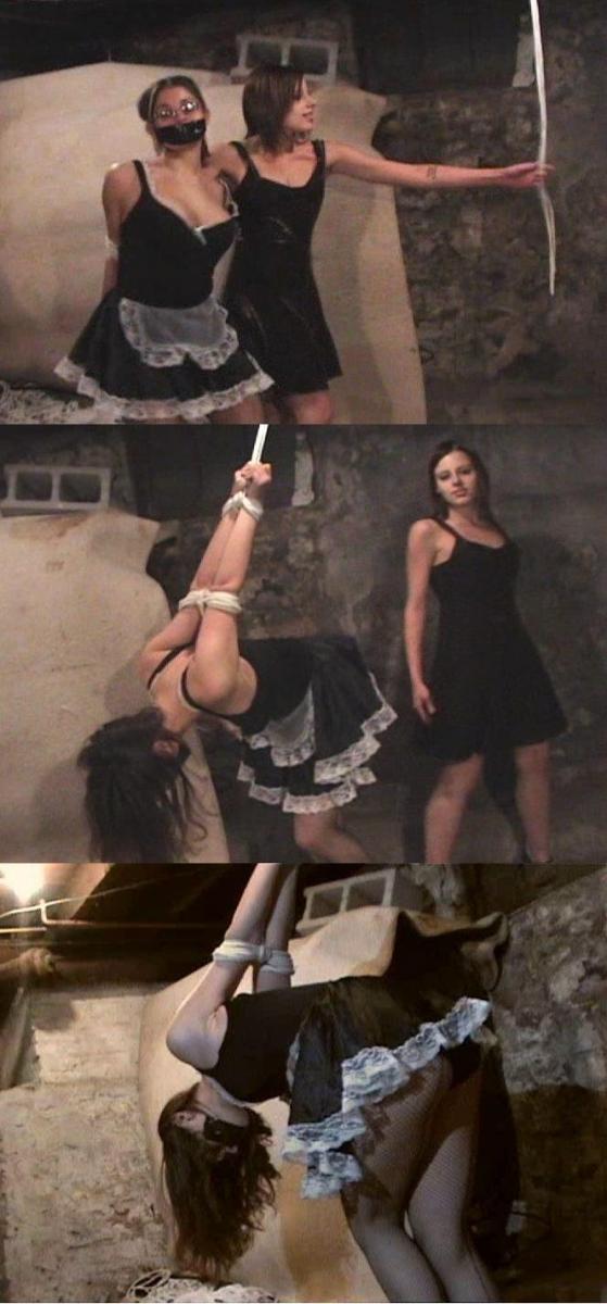 How I got my sweet revenge on my insane maid (repost)  After suffering for hours of being tightly taped to a chair, petite socialite Jessica has turned the tables on her insane maid. She drags the rebelious Angela down to the same spot that she her mistress. She has been overpuwered and tightly bound with ropes around her wrists and elbows. She tries to secure her to a rope hanging from the ceiling. She pulls the rope through he defiant maids elbows and pulls them up high to the ceiling. Angela yelps in pain as her shoulders are twisted painfully in their sockets as her mistress tries to tie off the knots. But the girl isn't that skilled at knot tying and she struggles to get the rope tied off which adds to the inflicted on Angela's shoulders and elbows as she cries in pain through her gag. Jessica finally gets the rope tied off and leaves to fetch more ropes. But he knot isn't very effective as Angela struggles she is able to get her elbows down from the insane strappado and hops over to a ledge to try to free her ankles. But Jessica returns too soon and manhandles the girl dragging her back over to the hanging rope. This time she attaches Angela's wrists to the rope and hoists her wrists up high behind her into a strict strappado. She then exacts her revenge with the same riding crop that she was with earlier. Spanking the crazy maid lifting her skirts and beating her ass. She tires soon and leaves the poor girl down in the basement struggling in pain and helpless to free herself. 