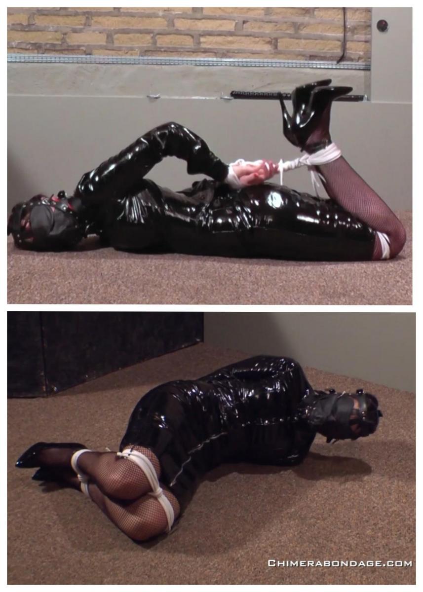  Strict PVC Hogtie Struggling 严格的PVC猪猪斗争<br><br>特蕾西·莱恩穿着黑色闪亮的PVC衣服、渔网袜和黑色漆皮高跟鞋，在地板上挣扎着，在她的室友把她绑起来、塞住嘴并蒙上眼睛后，她试图逃跑。在为特蕾西挣扎了几个小时后，她终于挣脱双手，摘下了眼罩，Strict PVC Hogtie Struggling<br>Tracey Lain dressed in her black shiny PVC clothing, fishnet stockings and black patent leather high heel shoes is struggling on the floor trying is to escape after her flat mate left her hogtied, gagged and blindfolded. After what seems like hours of struggling for Tracey she manages to get her hands free and remove her blindfold,