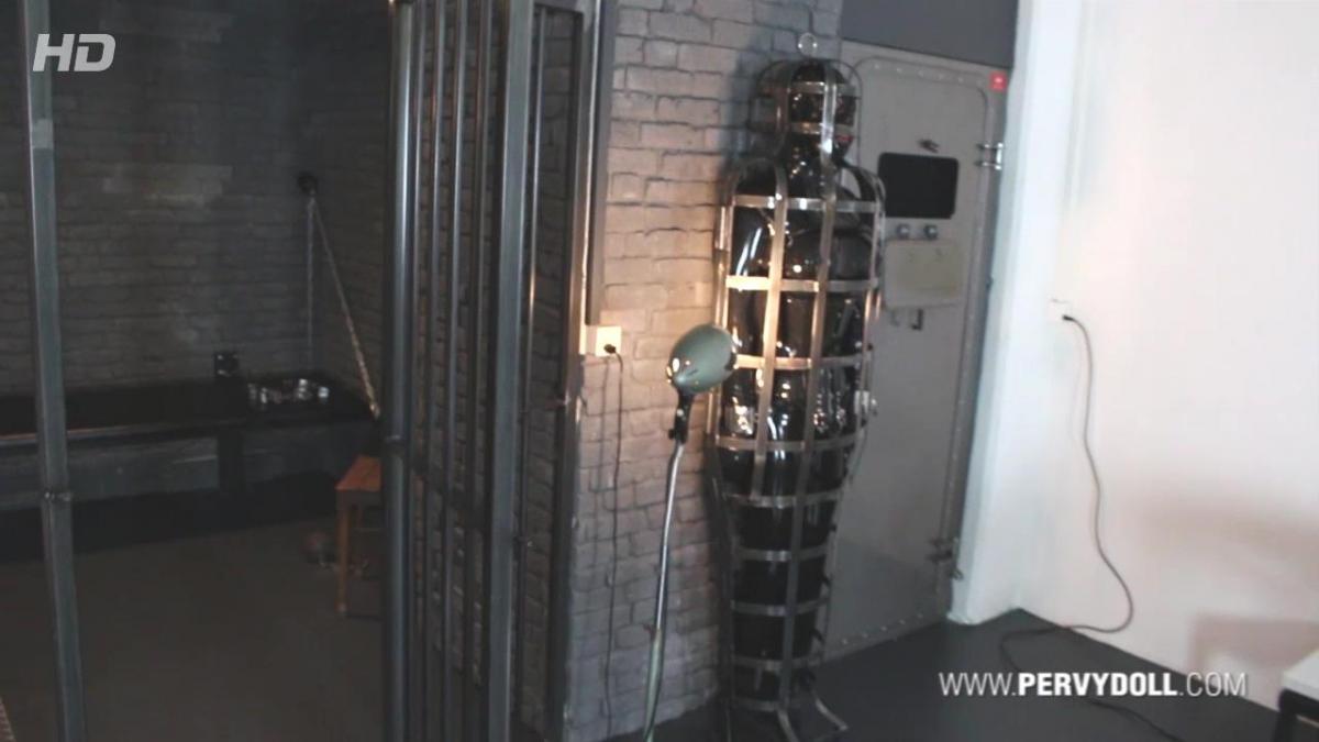 Bondage Helmet - Part 2 This week I was with Comtesse Larissa at then new and really awesome equipped new dungeon in Zürich, Switzerland, called "Der FemDOM". We give our visits mostly some pervy name and so we called it this time "Rubber Mania" and finally this was also on the schedule...<br><br>… we arrived monday morning in Zürich and started to unpack fastly our luggage and rubber because we were really short on time and had to rubberize ourselves and prepare everything for the session. I helped first Comtesse Larissa into the big boobed catsuit and so it happened that we already find ourselves while dressing up in the session, even if the guest wasn’t still in the dungeon.<br><br>I was dressed in my black lockable rubbercatsuit and as always I had to rubberize my crotch in a really pervy style. After that I was laced first into a black COR13 corset from HW-Design and another rubberpussy was attached between my legs. Double rubberpussy! This was even new to me too  but the feeling was incredible sexy and horny.<br><br>The real thing started after the corset. The Bondage Helmet. An integrated heavy rubber mask and neck corset, which can be added to the straps of the COR13 corset. It laces from top of the head to the complete end of the bondage helmet is therefore very restrictive and tight. Larissa had certainly a lot of fun squeezing my head into this rubber head prison and strapping it to the corset then.<br><br>She watched on her work and let me turn one time to see the complete beauty of this restrictive outfit. Then she started to rub my double rubberized pussy in my crotch, when she realized that the guest has written a SMS telling that he will be 2 hours late because of heavy traffic jam. This was the moment, when Larissa became a horny and breathtaking plan. She put me for this time into the gibbet cage. Fully laced and corseted as I was, I was put into this almost tight and unbreakable metal stand prison…