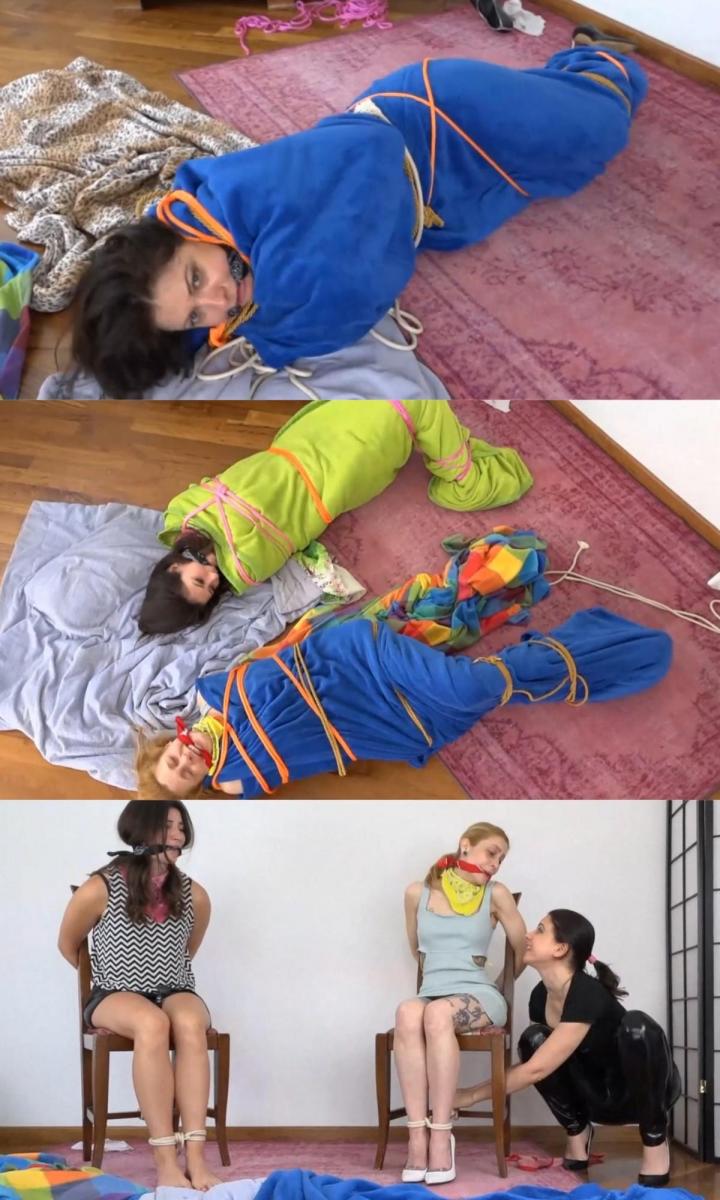 An unexpected revenge ( MUMMIFICATION ) Gisy是个混蛋，计划和两个女孩约会。第一个目标是厨房里的斯特拉。她用绳子把女孩的手绑起来，然后用一个切肉刀迅速堵住她的嘴。然后她被带到一个隐蔽的地方，在那里她被绑在一把椅子上。<br><br>莉莲将是第二个女孩。这次是在卧室里。Gisy做了和第一个女孩一样的捆绑和塞住嘴的动作，也把她带到了隐藏的地方。<br><br>在躲藏的地方，Gisy然后bei给女孩们带来了很多手帕和毯子。<br><br>吉茜说：是时候让自己舒服了。她拿了两条手帕，把一条绑在每个女孩的脖子上作为围巾。之后，Gisy改变了女孩们的噱头。她紧紧地用手帕把他们劈开。然后，她把每个女孩的手、腿和脚绑好，然后把它们放在地板上。<br><br>然后Gisy拿起毯子，把每个女孩裹在一个毯子里，用绳子把毯子固定在她们的身上。然后吉茜把她们裹在另一条毯子里，把女孩们留下来收赎金。女孩们试图解放自己，但她们的插科打诨被弄湿了，她们开始流口水。<br><br>然后他们中的一个可以解放自己并帮助另一个。当吉茜回来时，两个女孩把吉茜绑起来，放在毯子里做木乃伊。之后，Gisy被一条手帕堵住了嘴，其中一个女孩之前也被堵住了嘴。然后他们离开吉茜去挣扎。Gisy is a *er and plans to ki**p two girls. The first target is Stella  from the kitchen. She ties the girl‘s hands up with rope and gags her quickly with a cleavegag. Then she is taken to the hiding place where she gets tied to a chair. <br>Lilian will be the second girl. This time frome the bedroom. Gisy does  the same tying and gagging like she did with the first girl and brings her to the hiding place too.<br>In the hiding place, Gisy then bei brings lots of bandanas and blankets to the girls.<br>Gisy says: Time to make yourselves comfortable. She takes two bandanas and ties one arround each girl‘s neck as a scarf.After that Gisy change the girls gags. She cleave gags them with a bandana tight. Then she ties each girl well on hands, legs and feet and puts them on the floor.<br>Then Gisy takes the blankets and wraps each girl in one and secures the blankets to their bodys with ropes. Then Gisy wraps them in another blanket and leaves the girls behind to collect the ransom. The girls try to free themselves and their gags gets wet and they start drooling through their gags. <br>Then one of them can free herself and helps the other one. When Gisy comes back the two girls tie Gisy up and mummify her in the blankets. Afterward Gisy gets gagged with one bandana which one of the girls was gagged before. Then they leave Gisy to struggle.