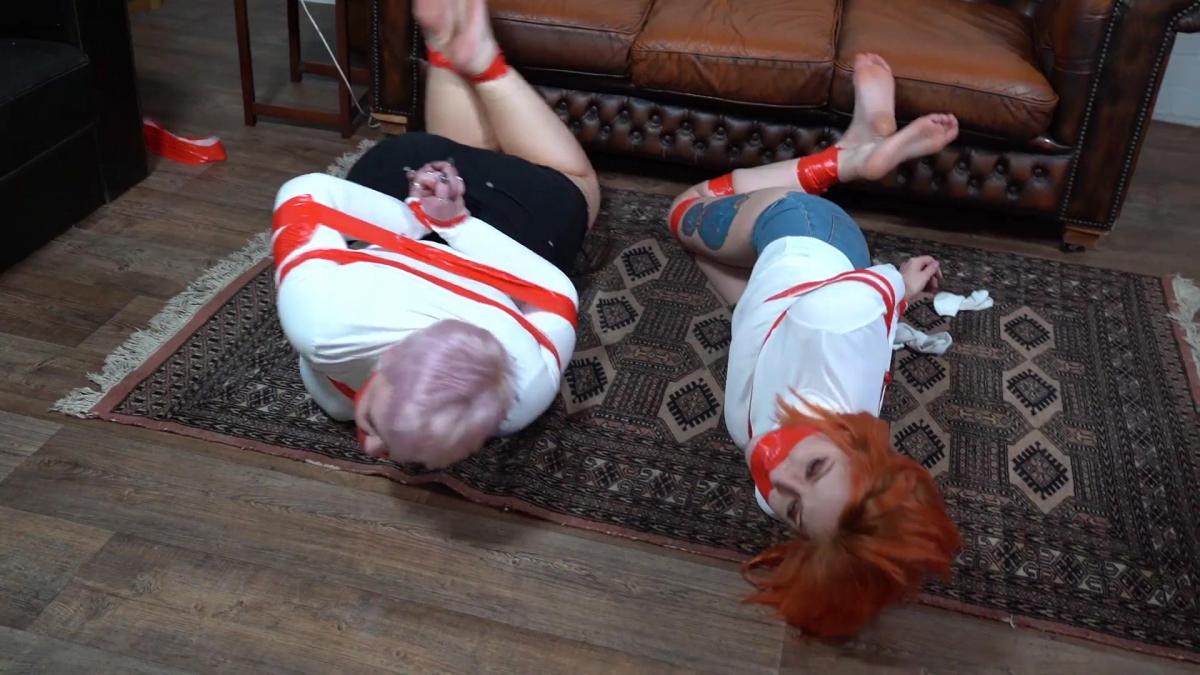 1192 Amber and Roxie with Mia in Barefoot Tape Up Amber and Roxie are already taped up the red coat of today deserve to be killed with the most violent 