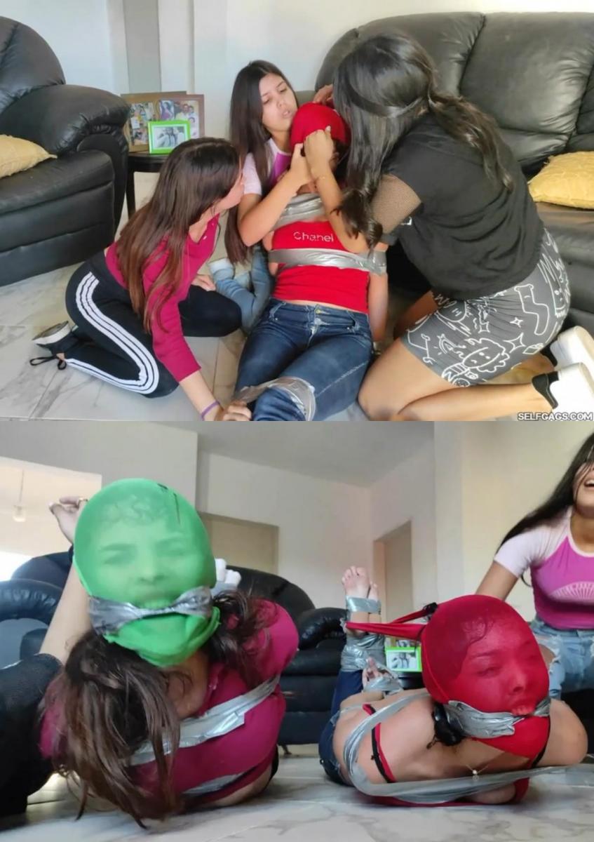 Sexy Pantyhose Hooded Bitches Hogtaped And Gagged Tight! 三只漂亮的母狗（玛丽、尚塔尔和桑德拉）抓住了高个子女孩尤尔卡，把她变成了他们自己绑着连裤袜的小猪女孩！但今天不仅仅是尤尔卡变成了一个被束缚的小猪女孩！<br><br><br><br>性感尤尔卡的手腕被绑在背后，嘴巴被胶带塞住，她被冲进房子，坐在沙发上。在这里，三只母狗漂亮地合作，把活泼的尤尔卡绑起来，这样他们就可以把她变成一个小猪女孩。<br><br><br><br>Xandra在Yurca身上做着持续而坚定的[X_X]，而Mary和Shantal则在做胶带扎带。尤尔卡把自己绑得又好又紧，头裹在性感的粉色连裤袜里，然后从裹着的连裤袜外面在嘴里撕开几层胶带！<br><br><br><br>女孩们紧紧地抓住尤尔卡，用胶带把她的脚绑在一起，把裤袜的松散一端绑在她绑好的脚踝后面，把尤尔卡的头举得很高，处于一个非常不舒服的姿势！<br><br><br><br>三个婊子喜欢他们的束缚工作，并取笑他们无助的小猪女孩，她在沮丧和绝望中呻吟和哀嚎！因此，当尤尔卡被捆绑在一起时，玛丽和尚塔尔突然抓住了他们的队员珊德拉，给了她和尤尔卡完全一样的待遇！Three gorgeous bitches (Mary, Shantal & Xandra) have captured tall girl Yurca to turn her into their very own bound and pantyhosed piggy girl! But it ain't just Yurca who becomes a hogtied piggy girl today!<br><br>With her wrists tied behind her back and her mouth tape gagged, Sexy Yurca gets rushed into the house and sat on the sofa. Here, the three bitches beautifully cooperate to get feisty Yurca tied up so that they can turn her into a piggy girl.<br><br>Xandra is doing constant and firm hand-over-mouth on Yurca while Mary and Shantal do the duct tape ties. Yurca gets tied up super nice and tight and has her head encased in sexy pink pantyhose followed by layers of duct tape cleaved inside her mouth from the outside of the encasing pantyhose!<br><br>The girls tightly hogtapes Yurca, duct tapes her feet together, and ties the loose ends of the pantyhose encasement to the back of her bound ankles, holding Yurca's head up high in a super uncomfortable position!<br><br>The three bitches adore their bondage work and tease their helpless piggy girl who moans and whines in frustration and despair! So with Yurca all bound up, suddenly Mary and Shantal grab their team-player Xandra and gives her the exact same treatment as Yurca!<br>