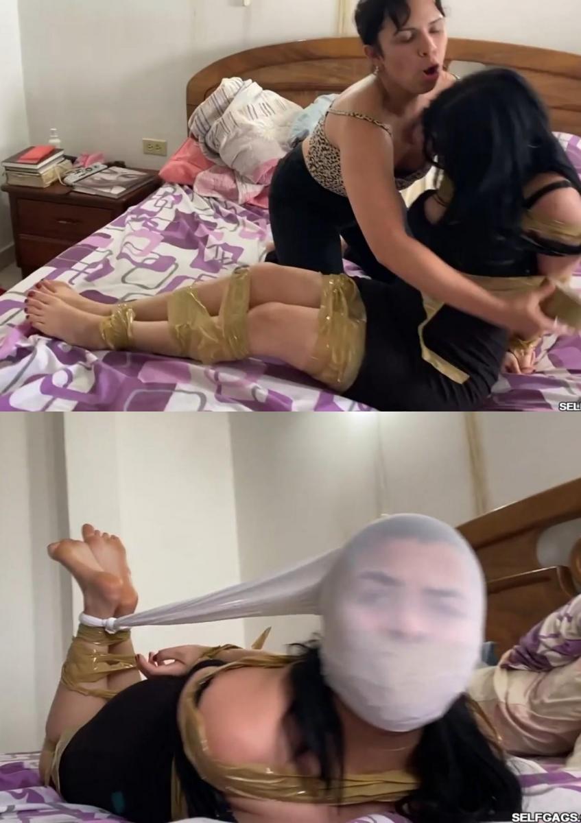 Slutty Stepsister Stays Home Xandra打扮得漂漂亮亮，准备去参加派对。她在客厅里从她的姐姐贝莎身边经过，然后说再见。Betsa注意到Xandra穿着什么肮脏的衣服，并说她不能穿着那样肮脏的衣服去任何地方！<br><br><br><br>Betsa对Xandra很生气，于是她抓住Xandra的头发，带她上楼，走进他们家的卧室，在那里她用棕色包装胶带把她绑起来！Betsa找到了一条继母的脏内裤，把它们塞进Xandra的嘴里，然后把胶带像一个紧的胶带一样绕在她的头上！<br><br><br><br>Xandra拼命挣扎，嘴里塞着继母的脏内裤，发出了很多令人[X_X]的抗议。她试图逃跑并走出房间，但很快被Betsa抓住，并跳回卧室。<br><br><br><br>Xandra的头被绑在一条白色连裤袜里，连裤袜绑在她绑着的脚踝后面，这让她成了一个被束缚的囚犯。她无助地挣扎着，对她占主导地位的继姐妹非常生气，她完全确定今晚不能出去！Xandra is all dressed up and ready to go to a party. She passes by her older stepsister Betsa in the living room and says goodbye. Betsa notices what slutty clothes Xandra is wearing and says she cannot go anywhere wearing slutty clothes like that!<br><br>Betsa becomes angry with Xandra so she pulls Xandra by her hair and walks her up the stairs and into their folks' bedroom where she binds her with brown packing tape! Betsa finds a pair of stepmom's dirty panties, stuffs them in Xandra's mouth, and wraps tape around her head like a tight tapegag!<br><br>Xandra struggles desperately and makes a lot of gagged protests with stepmom's dirty panties taped in her mouth. She tries to escape and makes it out of the room, but she is quickly caught by Betsa and made to hop back to the bedroom.<br><br>Xandra has her head encased in a white pair of pantyhose tied to the back of her bound ankles, making her a hogtied bondage prisoner. She struggles and mmpppphs in helplessness, truly angry with her dominant stepsister who made totally sure she couldn't go out tonight!