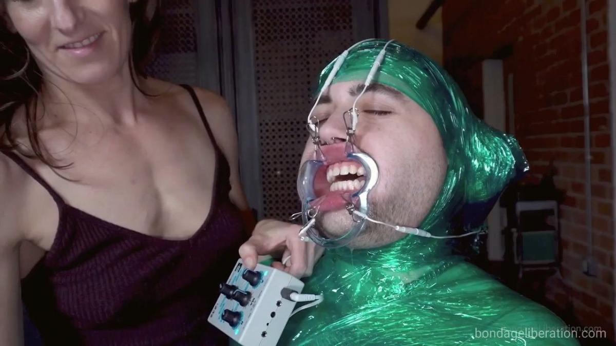 Facial Distortion with Elise Graves When Elise Graves pitches to me her most fucked up fantasies, you already know I'm always up for whatever she has in store for me! This time is no different, as she straps me to a vintage dentist chair via a green cellophane wrap