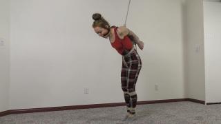 QT1054 Danielle Dean Danielle Dean has some very special skills. One of them is her ability to touch her elbows together behind her back without any assistance – a skill she demonstrates before struggling tied standing, ball gagged and wearing a cute plaid jumper outfit – with her elbows tied together, of course