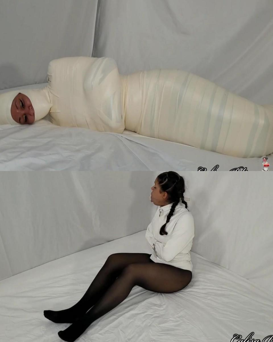 Calisa Bliss: Mummy Asylum 卡丽莎醒来时，嘴巴被堵住，穿着紧身衣，不知道自己在哪里。 她穿着紧身衣挣扎，同时通过巨大的堵嘴呼救。 最后，一名护士（萨法里岛）进入现场，让卡丽莎平静下来。 萨法里护士解释说，卡丽莎昨晚被送往医院，因为她在酒吧里表现得很疯狂。 起初卡丽莎以为这是个玩笑，但 Safari 向她保证有视频证据。 卡丽莎听后决定同意去医院接受治疗。 当她再次醒来时，她发现自己的身体已被微泡沫胶带包裹，直至肩膀。 她询问护士发生了什么事，并被告知这都是治疗的一部分。 卡丽莎更加困惑，但护士继续将她包裹起来，只露出她的鼻子和眼睛。 当护士检查她的工作时，卡莉莎像木乃伊一样挣扎着。 她翻了个身，弯曲手指试图挣脱。 天气又热又紧，她已经没力气了。 她终于开始平静下来并欣赏她的木乃伊身体，但随后护士回来告诉她，她将成为木乃伊医院的永久居民。Calisa wakes up gagged and in a straitjacket with no knowledge of where she is. She struggles around in the straitjacket while calling for help through the giant gag. Finally, a nurse (Safari Island) enters the scene to calm Calisa down. Nurse Safari explains that Calisa was brought to the hospital last night because she was acting crazy at a bar. At first Calisa thinks it's a joke but Safari assures her that there is video proof. After hearing this, Calisa decides to consent to treatment at the hospital. When she next wakes up, she sees that her body has been encased in microfoam tape up to her shoulders. She asks the nurse what's going on and is told that it is all part of the treatment. Calisa is even more confused but the nurse proceeds to wrap her up leaving only her nose and eyes exposed. Calisa struggles around while mummified as the nurse inspects her work. She rolls around and flex's her fingers trying to free herself. It's hot and tight and she's running out of energy. She finally starts to calm down and appreciates her mummified body, but then the nurse comes back in to tell her that she'll be a permanent resident of the Mummy Hospital.