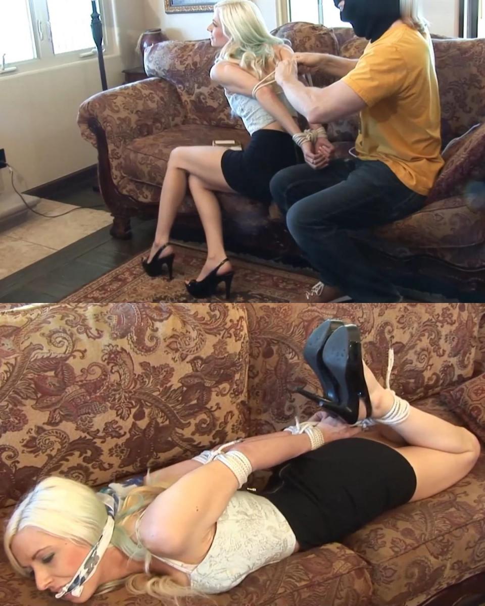 NEW FOOTAGE! NEW VIDEO! Danielle Trixie Handgagged, Hogtied in Heels in Home Invasion for Ransom!   金发女郎丹妮尔·特里克西 (Danielle Trixie) 穿着紧身裙和高跟鞋在家中放松，一名蒙面男子从日光浴室潜入，用手堵住了她的嘴！ 这是入室盗窃！ 她被告知保持安静并将双手放在身后。 她答应了，很快可怜的丹妮尔，一位气象员的女儿，她的双手就被绑在身后。 她的肘部也受到严格限制！<br><br>接下来就是作呕！ 一块白布被揉成一团，塞进她嘴里。 一条围巾被拉到她的牙齿之间以将其固定在那里，这样她的嘴就被劈开。 现在明显安静了，她的脚踝被绑着，高跟鞋的特写镜头很漂亮。<br><br>蒙面男子将少女折叠起来，将她绑在沙发上。 然后他拿出手机为她的富爸爸制作了勒索视频。Blonde Danielle Trixie was relaxing at home in her tight skirt and high heels when a masked man sneaked in through the sunroom and handgagged her! It’s a home invasion! She’s told to keep quiet and put her hands behind her. She complies, and soon poor Danielle, daughter of a very weather man, has her hands bound behind her. She’s strictly elbow-bound, too!<br><br>Next comes the gagging! A white cloth is balled up and stuffed in her mouth. A scarf is pulled between her teeth to keep it there so she’s cleave-gagged. Now significantly quieter, her ankles are tied, with nice closeups of her high heels.<br><br>The masked man folds up the damsel so she’s hogtied on the sofa. Then he pulls out his phone to make the ransom video for her rich daddy.