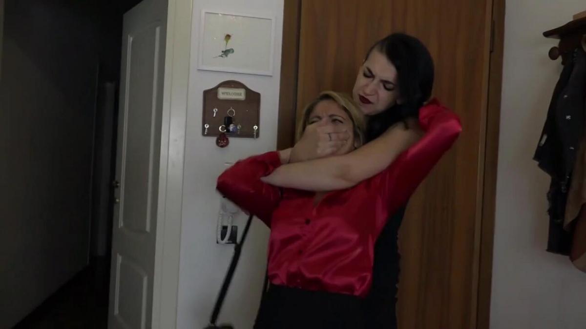 A dangerous owner Alba is a thief that has entered a house, but just as she wants to leave, the owner of the house, another dominant woman, grabs her by the hair and presses her cheek against the window, saying that she's called the police and will not let her get away before the police arrives. She keeps Alba struggling against her grip, pressing her cheek hard on the glass, but after 4 minutes Alba eventually breaks free and tries to run away but trips over something and falls to the floor. The landlady grabs an item she had in her nightstand beside her bed and sits on Alba's chest. Alba is terrified but tries to act tough as the other woman strokes her face with the item, sometimes pressing it hard into her cheek, sometimes pressing the tip of the item against Alba's nose and pressing her nose upward, sometimes even putting the item in Alba's mouth. Alba is too scared too move, not knowing if the woman is going to shoot. After 4 minutes of playing with the item on Alba's face, switching between pressing it on her nose, cheeks and into her mouth, she puts the item away and handgags Alba, putting her hand on her mouth, the thumb facing down and the top side of her hand pushing Alba's nose up, folding it upward, making it impossible to breathe. She then releases her grip, before squishing Alba's cheeks hard, obliging Alba to look at her while she trash talks into her face almost sensually. She switches between hand smothering and face squishing for 4 minutes before Alba surprises her and throws her off. She tries to run away again but the dominant woman is faster, throws Alba on her belly and sits on her back, her back facing Alba's head. The woman's feet are just in front of Alba's face. The dominant woman grabs Alba's hands and holds them on her back with one hand, and with the other hand she grabs Alba's hair and presses her face into her foot so that the mouth and nose are tightly squashed against the sole of her foot. After 4 minutes, she hears the police arriving and holds a still struggling Alba in place, pressing her face into her feet.<br>FULL HD ENG