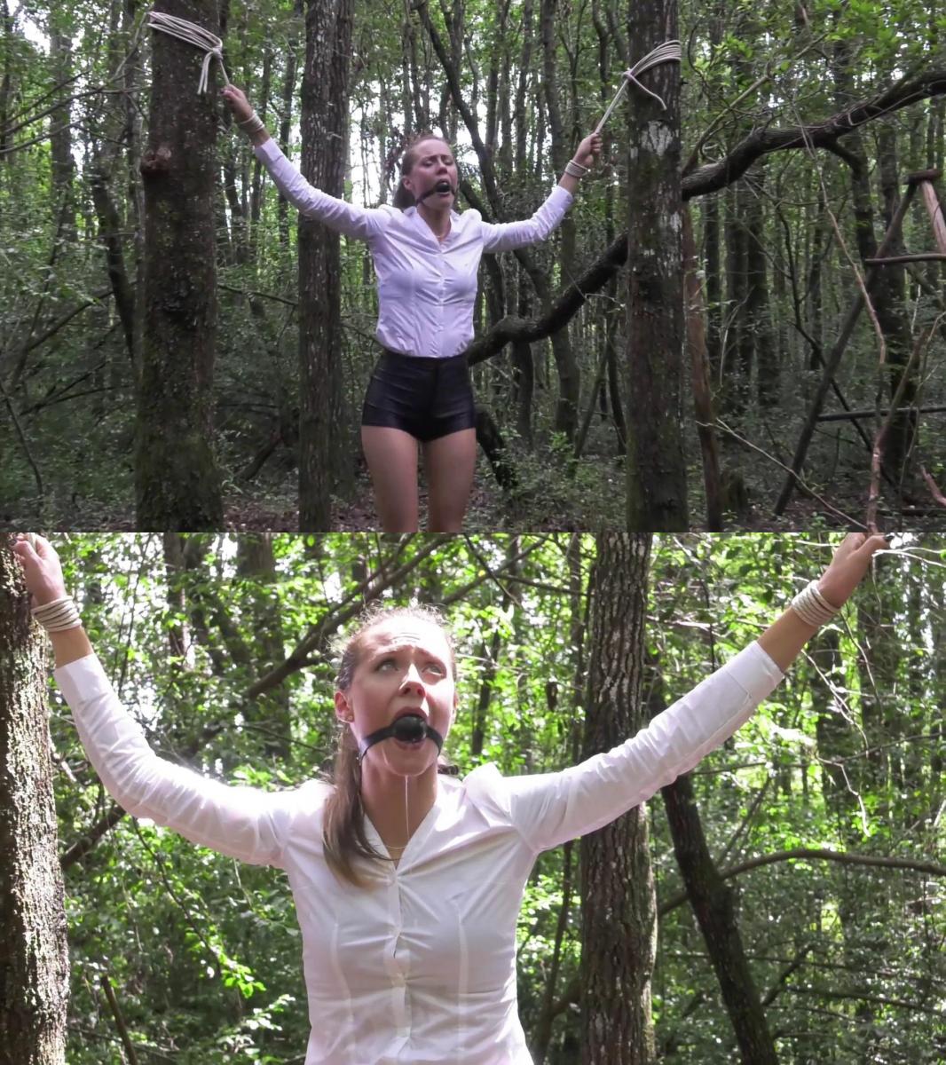 Between two trees Madalynn Raye Bondage Presents "Tied Between 2 trees"<br><br>Poor Maddy, strung up again in the woods to drool all over herself.<br>Tight disco shorts and thigh ropes pulling in opposite directions, she's pretty well stuck!