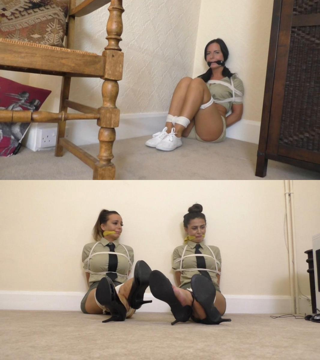 Melody (Feat Demi &amp; Jade) in: Adventures of the SwizzleStick Academy: Guards in Trouble &amp; a  Melody (Feat Demi & Jade) in: Adventures of the SwizzleStick Academy: Guards in Trouble & a Crazy Case of Counterfeit Crustaceans!<br><br>In this nail-biting thriller, we have an insidious being made against the beautiful young ladies of The SwizzleStick Academy. Another one?? Yep. And you love this. This latest chick-batch and the organisation they represent have come on leaps and BOUNDS in recent months. They’ve even evolved a new security wing, who are hired out by various public bodies such as… the BustaGonad Museum of Natural Histawy. Yes, certain displays there have been being targeted for theft and nobody has yet managed to catch the culprit in the act. Hopefully, with these two beautiful girlies, looking cute enough to cute all over in their little uniforms and ties, aaaaahhhhhh, will deter any would be miscreants from acting out. And pigs may just achieve physical aviation, right? For now, these two are being tossed heels first straight down the Borderland Bound pig chute!<br><br>The renowned museum, now into the fourth day of the once in a lifetime display of the illustrious ‘Crystalized Cretaceous Crustaceans’, has already seen an uncomfortable discovery has been made... well, two actually, if we first go back to the previous week… On THAT occasion, two beautiful SwizzleStick hired guards were discovered tightly bound and gagged in the east wing of the building,  display cases smashed, giant earwigs and whatever else gone! Indeed, a brazen thief overpowered the two with ease, bound their bodies, gagged their mouths (that yellow cloth cleaving the mmmmppphhhhing stunners looks as great as ever – should we use it more?) and made off into the night!<br><br>We enjoy very much the action here as the tied up ladies writhe around on the floor, ankles trussed crossed, trying very hard to communicate through the cloth tying their mouths up. They can’t do anything except mumble, and that is very, very cool with us. So anyway, this is the first ‘incident’, and jolly well exciting it is too – have you SEEN these babes? Uhh, soooo hot. But now, to the second discovery! Far more insidious, but no less hair and whatever else raising! Some of these crustaceans are counterfeit! Yes, remember them? Stick with us, folks, because we all know what this means!!!<br><br>Yes that’s right, time to call in another young recruit from the Swizzlestick! The academy rapidly dispatches their top girl archaeologist, a raven haired beauty named Miss Mack to find out just what exactly the fudge is going on here. After grilling the museum staff, one sideways individual, a Mr. Ralph Rustynuts, wearing a medieval executioner’s mask, has set off the alarm bells. Yes it seems old Ralphie has been behind a few past incidents regarding priceless antiquities and the like. After a stint at the funny farm he has been given a chance to rehabilitate himself with a part time job as a custodian at the museum, with the hopes he will begin to appreciate this stuff instead of stealing it (we think the museum should review their hiring practices? And while we are at it, how come all of the girl archaeologists at this so called academy are gorgeous? Think we will turn a blind eye to that one).