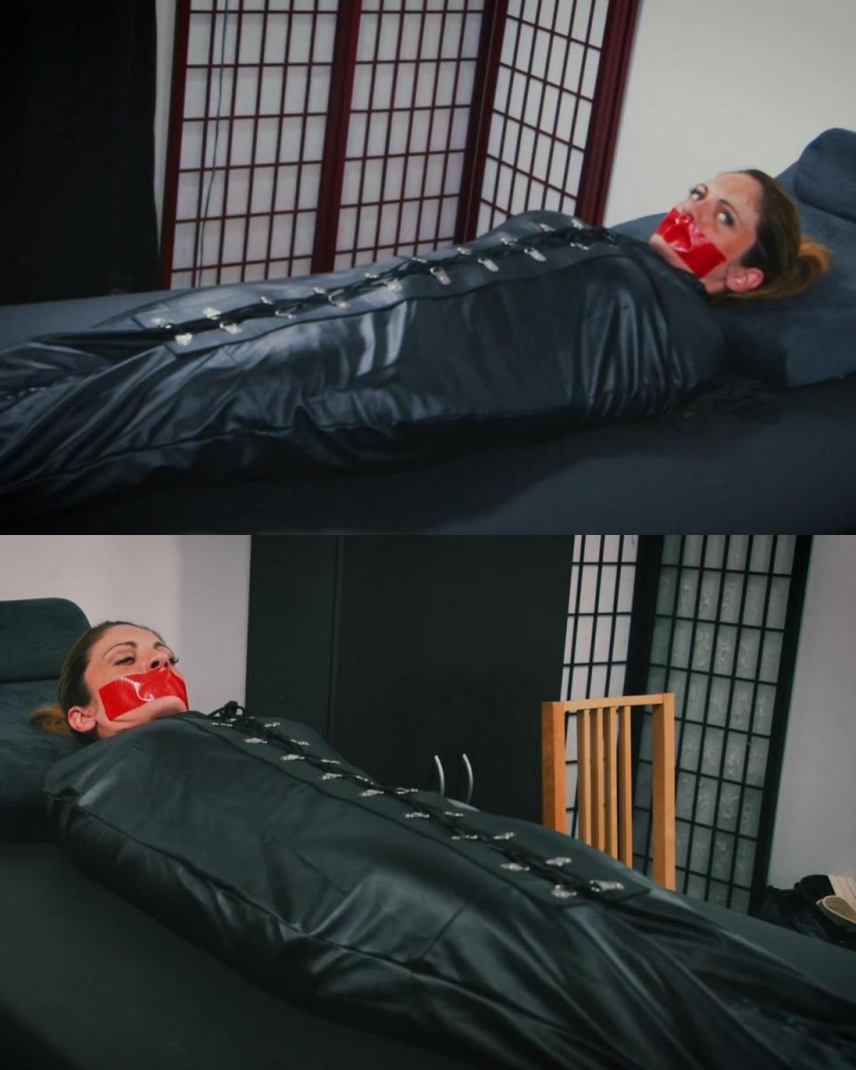 ALBA ZEVON SLEEPSACK BONDAGE Alba Zevon 发现自己被紧紧地绑在皮革睡袋里，手臂被困在身体两侧，绑得严严实实，她几乎动弹不得！ 但这并不能阻止她拼命地蠕动和呻吟，试图将自己从严格的束缚中解放出来。 当然，没有堵嘴的束缚是不完整的，阿尔芭美丽的嘴唇被红色的粘性胶带封住，使她无法说话。 剩下的就是看着她蠕动和挣扎，因为她的束缚让她感到越来越兴奋和兴奋。Alba Zevon finds herself tightly bound in a leather sleepsack, arms trapped at her sides, securely and strictly bound, she can barely move!  That doesn't stop her from desperately squirming and moaning, trying to free herself from her strict bondage.  Of course, no bondage is complete without a gag and Alba's beautiful lips are sealed shut with red, sticky duct tape, making it impossible for her to speak.  All that remains is to watch her squirm and struggle as her bondage makes her feel more and more turned on and excited.