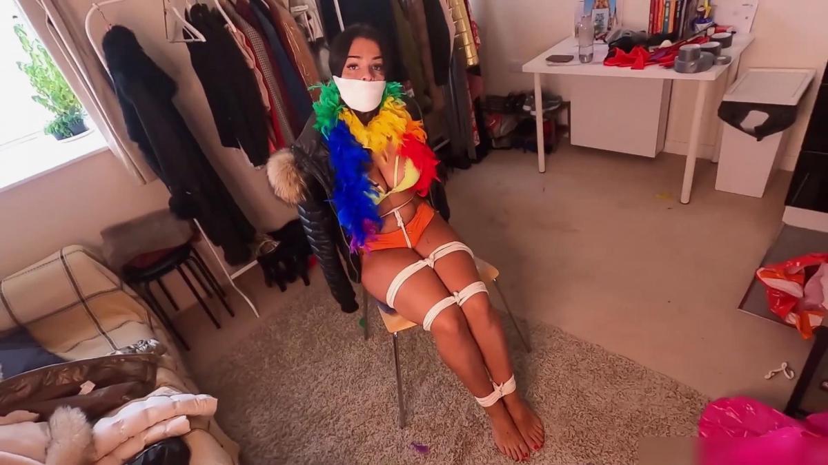 Latina bound tight and gagged with different gags! While wearing feather boa and different fur parka Latina Bondage<br>Latina is a fashion blogger that reviews fur parkas. Suddenly receives a gift from a fan, it's a large feather boa but she doesn´t like feathers because it tickles her. What she doesn´t know is what will happen for being so ungrateful she is going to get in trouble...<br><br>Somebody turns off the light and captures her. She wakes up is sitting on a chair tied up really tight with the white rope and gagged with a tight wrap gag, captor have put a fur parka on her and wrapped her neck with a ticklish feather boa! What a predicament... She hates it, so she struggles a lot and asks to be let go. But her captor has different plans... Instead he decides to put a new fur parka on her and change her gag to a bit more strict one! So now she is gagged with a huge pink ballgag, and her struggle continues! She drools a lot and trying to escape by hopping to the exit, but she's being stopped from doing that and captor decides to change her fur parka and gag again... So now she is gagged with a super strict metal spider gag that will make her drool even more! She really can't stop complain, this predicament is starting to take a toll on her! So captor decides to gag her with even more strict gag to keep her quiet, a huge microfoam wrap! Now she can barely make any noise and looks like her predicament will never end...