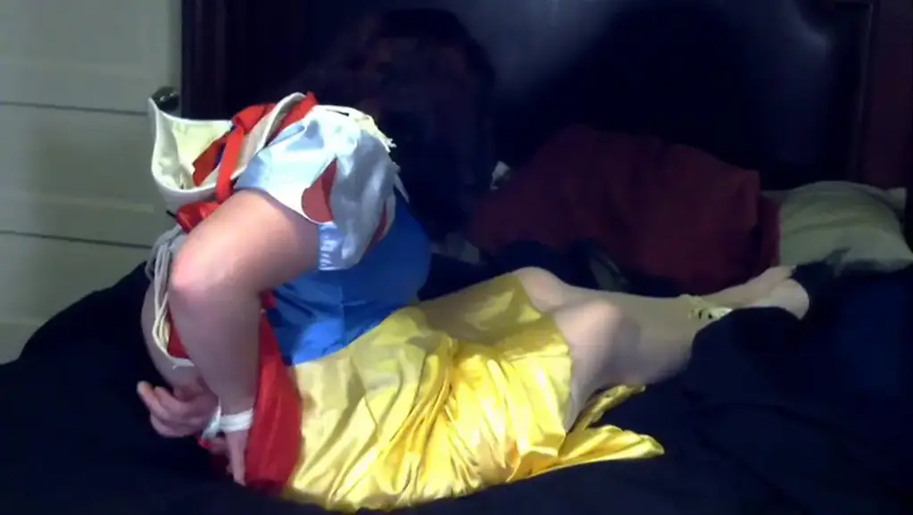 SNOW WHITE'S BAD NIGHT Rose Holland was all set to go to a costume party dressed up as Snow White when her boyfriend decided she wasn't going. To keep her in, he roped her up and when she protested too much, he shut her up with gold duct tape. She struggled mightily but it looked like she wasn't going to the party after all.