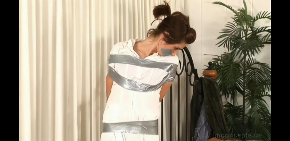 Natasha Warner – Taped Up Nurse Desperadoes in search of dope seize bewildered nurse Natasha Warner as soon as she returns home, bind and gag her with duct tape, then carry out their evil plan while Natasha rolls about on her bed! Before leaving, the heartless criminals pull their helpless victim off the bed and tape her to a bedpost, where poor Natasha twists and whimpers in her stockinged feet!