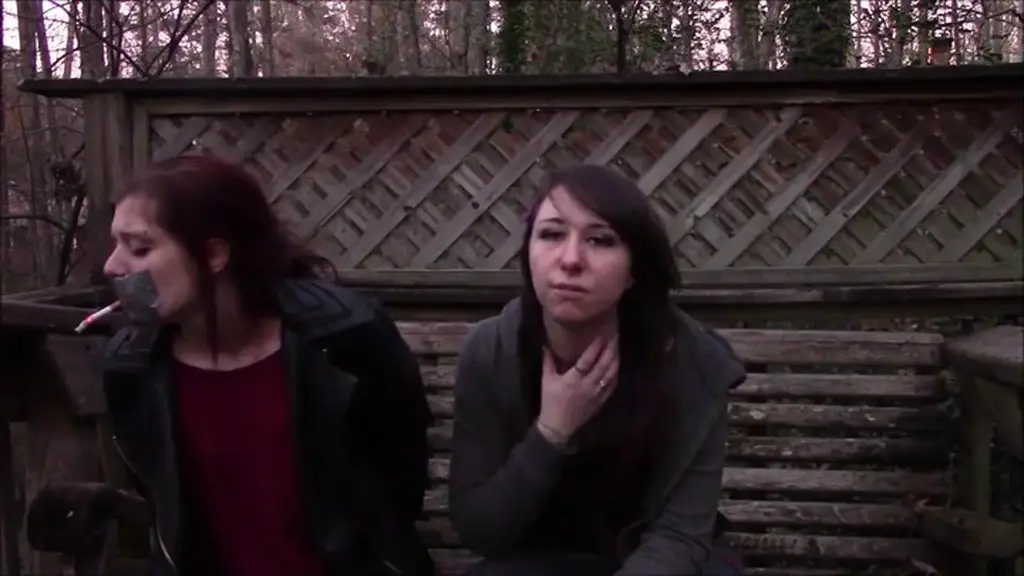 Dakota &amp; Gemi in: Making Little Step-Sister Smoke Through Hand Over Mouth And Tape Gag!  Dakota & Gemi in: Making Little Step-Sister Smoke Through Hand Over Mouth And Tape Gag! <br><br>Adorable sisters Dakota and Gemi are enjoying eachother's company on a bench in the great outdoors when little step-sister Gemi lights up a cigarette. Dakota is shocked by seeing her little step-sister smoke and tells her all the bad things cigarettes does to your body. Gemi doesn't care about her big step-sister's preach and enjoys her cig. Dakota threatens to tell step-mom that Gemi is smoking but that's not gonna happen unless Dakota want step-mom to find out about the guy she's dating. Dakota comes up with an idea to make Gemi quit smoking. Gemi has her hands duct taped behind her back and complains that she don't like being tied up. Dakota puts her hand over Gemi's mouth, places a cigarette between her fingers and lights it. Gemi mmphhs behind her big step-sister's handgag that makes her smoke the cigarette. Dakota holds onto her little step-sister's mouth nice and tight while explaining how she will make Gemi smoke all the cigarettes one after another to make her so sick that she never want to smoke again. Gemi is being rather resistant for being humiliated and dominated the way she is so Dakota swap hands to get a better grip on little step-sister's whimpering mouth, now keeping her handgagged and made to smoke with her arm going behind Gemi's neck. Gemi has almost smoked the whole cigarette through her big step-sister's hands when Dakota comes up with an idea that doesn't require her to keep handgagged. Dakota tape gags Gemi with 3 nice pieces of silver duct tape and makes a little hole in the middle of it. Dakota plugs a cigarette in the hole of Gemi's tape gag and lights it up. Mmpph mmpphh! Gemi's mouth is taped shut as she is made to inhale the smoke from the cigarette. Dakota verbally humiliates Gemi and tells her to finish the cigarette plugged in the middle of her tape gag if she want to smoke so bad. Gemi is in real agony for being unable to exhale all the smoke she inhales due to the duct tape on her mouth. Dakota checks Gemi's pack of cigs to see how many she can make Gemi smoke before step-mom gets home in a couple hours. The pack is almost full. Dakota is getting bored by her mmppphing little step-sister and tells her she'll be back to replace the cigarette in her tape gag with a new one in just a few minutes...<br><br>SATISFACTION GUARANTEED FOR ALL FANS OF HAND OVER MOUTH, SMOKING AND TAPE GAGS!<br><br>Included in this clip: hand over mouth, sisters, tied hands, duct tape, smoking, gag talk, domination, tape gag, verbal humiliation, outdoor bondage, brunette, handgag, redhead, muffled moaning 