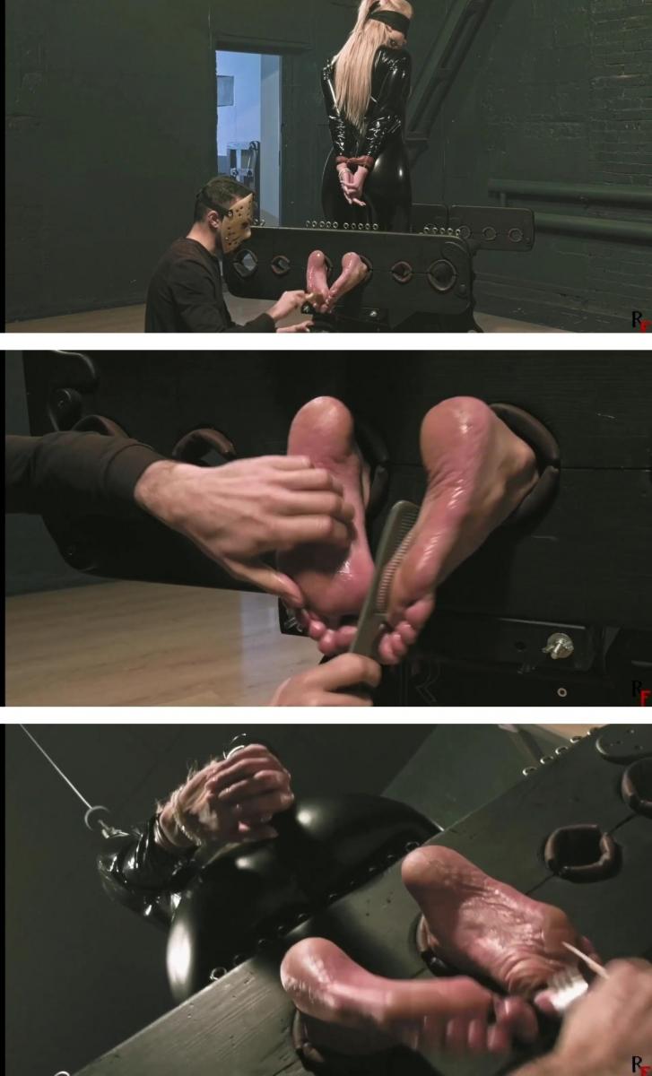 Kristina in black shiny catsuit - Intensive feet tickling in stocks (FULL HD MP4) In this video clip, the lovely Kristina is dressed in a catsuit. Her gorgeous boobs are sticking out of the shiny suit.<br>Her hands are bound behind her back and she is restrained in an intriguing kneeling position, with her big bare feet exposed. A gag is secured in her mouth, and a blindfold covers her eyes.<br>It's safe to say this is a very unusual position for her. She is vulnerable to falling, particularly because of her ticklish and sensitive feet. I'm right there with a pair of combs in my hands.<br><br>Throughout the session, I engage in an intense tickling of Kristina's bare soles. Her reactions of squealing and laughter fill the air. I find amusement in observing how she manages to maintain her balance and avoid falling, despite the challenging circumstances.<br>Enjoy!