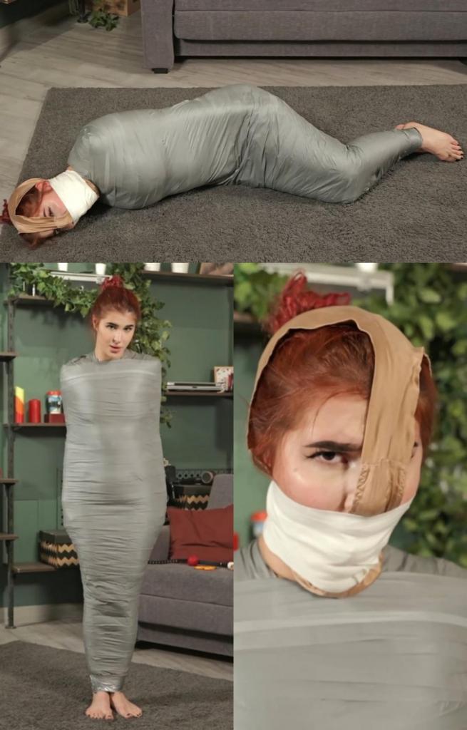 Pandora - Mummification and Smelling Her Week-Old Worn Panties 在这段视频中，潘多拉面临着真正的挑战。 她被用灰色胶带制成木乃伊，只露出头和赤脚。 当她稍微移动和挣扎时，我走近她，用一个红色的大口塞堵住她的嘴。<br><br>然后我拿出她自己的内裤，她为了这次拍摄专门穿了一周，让她彻底闻起来。 之后，我将它们放在她的头上，使胯部区域正好靠在她的鼻子上，确保她不断吸入自己发酵的气味。<br>我用白色微泡沫胶带将内裤紧紧地包住她的头，然后离开，让潘多拉独自享受她的气味。<br><br>潘多拉一开始站着，挣扎着，然后倒在地上打滚。 随着时间的推移，这种折磨变得越来越困难，因为鼻子周围的气味让她无法放松。<br>享受！In this clip, Pandora faces a real challenge. She is mummified with grey tape, with only her head and bare feet left uncovered. As she moves and struggles slightly, I approach her and gag her mouth with a large red ballgag.<br><br>Then I pull out her own panties, which she had worn for a week specifically for this shoot, and make her smell them thoroughly. After that, I place them over her head in such a way that the crotch area is positioned right against her nose, ensuring she continuously inhales her own fermented scents.<br>I secure the panties tightly around her head with white microfoam tape and leave, letting Pandora alone with her scent.<br><br>Initially standing, Pandora struggles, then collapses to the floor and rolls around. Over time, the ordeal becomes increasingly difficult as the scent centred around her nose doesn't allow her to relax.<br>Enjoy!