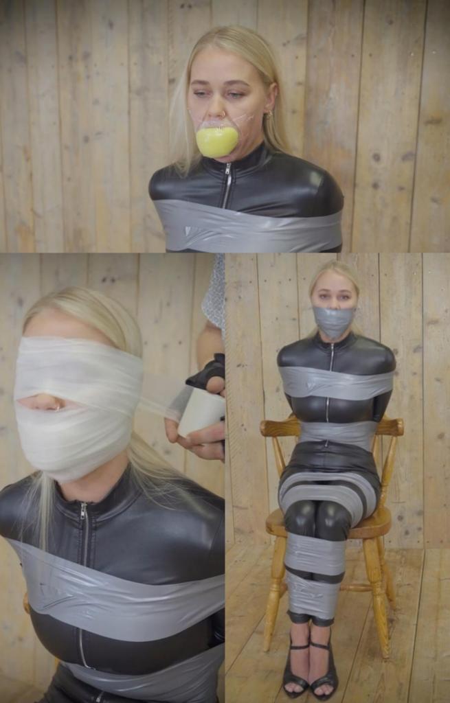 Darina - Catburglar Caught 达丽娜（Darina）是一名窃贼，她一直在错误的社区进行抢劫。 达丽娜被抓住并用胶带束缚。 她的嘴被塞住了，并用胶带封住了嘴。 她挣扎着挣脱束缚，但胶带将她紧紧地固定在原地。 达琳娜意识到她将来可能需要重新考虑目标的选择。 达丽娜的堵嘴被微泡沫切割堵嘴取代。 她试图说话……Darina is a catburglar that has been robbing the wrong neighborhood. Darina is grabbed and put in tape bondage. Her mouth gets stuffed and wrap gagged with duct tape. She struggles against her restraints, but the tape holds her tightly in place. Darina realizes she may need to rethink her choice of targets in the future. Darina's gag gets replaced with a microfoam cleave gag. She tries to speak...