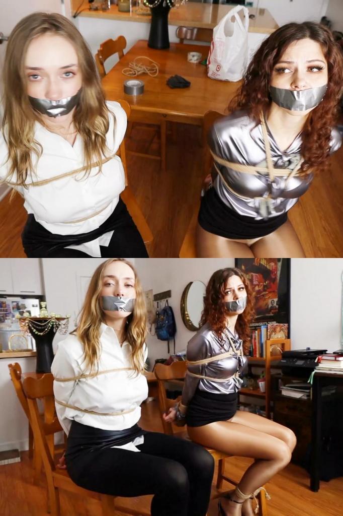 Jade Rose and Mina Salome: Tightly tied up and tape gagged detectives captured by a criminal magicia Jade Rose and Mina Salome: Tightly tied up and tape gagged detectives captured by a criminal magician (PART 1)杰德·罗斯是一名天真的菜鸟侦探，她正在采访一名魔术师，该魔术师报告说有人闯入了他的公寓并偷走了一套非常昂贵的魔术设备。杰德·罗斯对观看魔术的想法感到兴奋，因为她从未见过魔术，所以那个奇怪的人告诉她，他会给她演示一下。首先，他蒙住杰德的眼睛，让她坐在椅子上，然后让她数到 10。当被蒙住眼睛、不知道发生了什么的杰德高兴地数到 10 时，那个奇怪的男人走向水槽下的橱柜，打开橱柜，拉出被绑住并堵住嘴巴的米娜·莎乐美，让她走到杰德旁边的椅子上。倒计时结束后，杰德摘下眼罩，看到米娜被绑住并堵住了嘴巴。“来，我让这个女孩出现了！”杰德对这个“魔术”感到非常兴奋，而米娜试图警告她，但她的话被堵住了。 “魔术师”问杰德是否愿意参与魔术表演，她欣然同意了。假魔术师要求杰德将双手放在身后，而米娜则含糊不清地试图告诉她不要这样做，假魔术师说米娜只是嫉妒，因为她不会成为魔术表演的主角，杰德甚至试图告诉米娜不要担心这个……太天真了！杰德被绳子绑住后，坏人用胶带堵住了她的嘴，在确定杰德现在无助后，他透露了事情的经过：米娜是另一个追捕他的 FBI 特工，因为他计划使用魔法装备抢劫一家银行，但米娜未能逮捕坏人，我们的红发侦探最终被坏人绑起来并堵住了嘴，然后当杰德接到抢劫报告后赶到时，坏人将她藏在了水槽柜里。但现在坏人已经绑住了两名特工，并堵住了他们的嘴，魔法装备也落入了他的手中，所以这个假魔术师的运气很好。米娜和杰德都在挣扎，试图挣脱，但绳子太紧了，他们哪儿也去不了！！未完待续……Jade Rose is a naive rookie detective is interviewing a magician who has reported somebody broke into his apartment and stole a very expensive magician equipment. Jade Rose gets excited with the idea of seeing a magic trick as she has never seen one, so the weird guy tells her he will give her a demonstration. First, he blindfolds Jade and makes her sit on a chair then tells her to count to 10. While Jade, blindfolded and unaware of what is going on, happily counts to 10, the strange man walk towards an under-sink cabinet, opens it and pull out Mina Salome, bound and gagged and makes her walk to a chair by Jade's. When the countdown is over Jade removes her blindfold and sees Mina tied and gagged. "Here. I made this girl appear!" Jade is so excited with the "magic trick" while Mina tries to warn her but her words are muffled by the gag. The "magician" asks Jade if she'd like to be part of the magic trick, and she eagerly agrees. The fake magician asks Jade to put her hands behind her back while Mina with muffled words tries to tell her not to do it, the fake magician says Mina is only jealous because she won't be the protagonist of that magic trick, Jade even tries to tell Mina not to worry about that... so naive! Once Jade is bound with rope, the bad guy gags her with duct tape and after making sure Jade is now helpless, he reveals what's going on: Mina was another FBI agent after him, because he plans to rob a bank using the magic gear, but Mina failed in her attempt to arrest the bad guy and our redhead detective ended up tied up and gagged by the bad guy before he hid her in the sink cabinet when Jade arrived after a report of a robbery in the place. But now the bad guy has two agents tied and gagged, and the magic gear in his possession, so things are going great for this fake magician. Both Mina and Jade struggle and try to get free but ropes are too tight, they won't go anywhere!! To be continued...