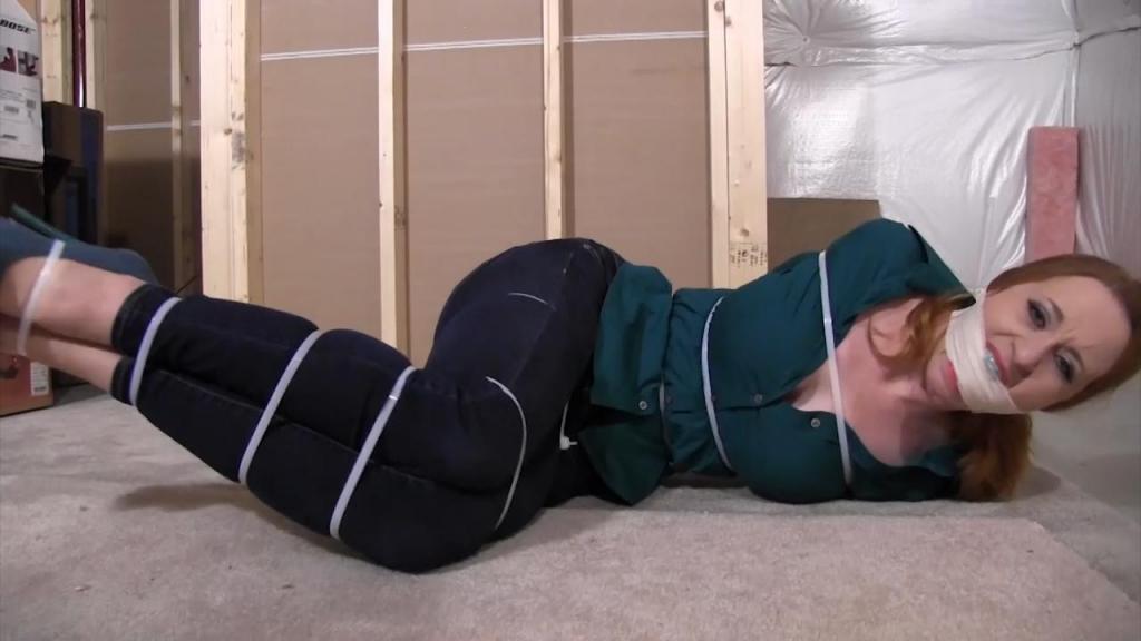 2211SERENE_Zip-Tied and gagged in the basement Someone has Serene bound with plastic zip ties in a basement. Her mouth is also stuffed and taped to gag her. She struggles hard to get loose. But all she accomplishes, is getting her tight jean to slide down her hips to show she is wearing pantyhose and thong panties under.<br><br>