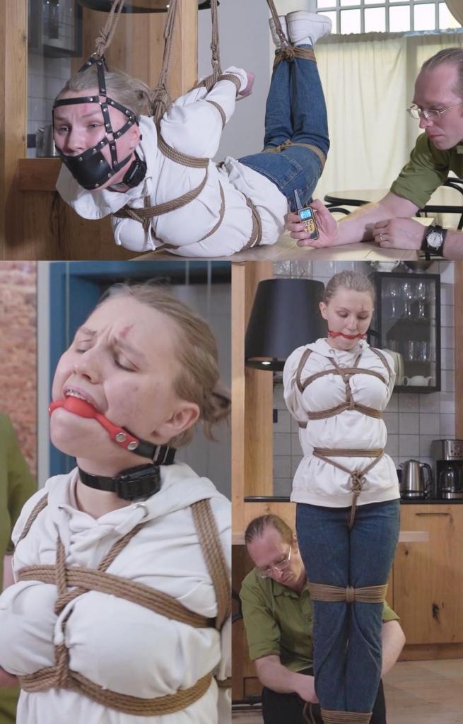 SHOCKING RORE FANTASY: FORBIDDEN ECSTASY 布兰布尔心甘情愿地顺从，她穿着休闲服装，但她即将被变成一个被束缚的无助奴隶。绳索专家菲德勒控制了她，用紧身绳索将她的躯干包裹起来。胯部绳索被绑住，让她极度不舒服。布兰布尔的眼睛睁大，既恐惧又兴奋，她感觉到绳索在束缚着她，疼痛和不适让她兴奋不已。<br><br>布兰布尔的肘部被绑在身后，她的抵抗能力有限。她被套上一个红色的口球，让她无法反抗，但她仍然能感受到完全被菲德勒摆布的恐惧和刺激。菲德勒绑住了她的膝盖和脚踝，让她无法动弹，布兰布尔的心因期待而跳动。脖子上戴上了一个电击项圈，提醒她谁是主人，一想到即将到来的痛苦，布兰布尔就不寒而栗。<br><br>布兰布尔被放在桌子上，她的身体无助而暴露。电击项圈被测试，导致她跳起并抽搐，布兰布尔的眼睛因痛苦和快乐交织而变得呆滞。然后，菲德勒将她半吊起来，手脚被绳子绑住，布兰布尔感觉自己正在实现她最狂野的幻想。球形口塞被替换为面板口塞，用绳子将其拉起，确保她保持安静，布兰布尔完全听从菲德勒的摆布。<br><br>菲德勒没有征求她的同意，布兰布尔喜欢这样。她想被支配，被带到痛苦和快乐的边缘。绳子很紧，疼痛是真实的，但布兰布尔的兴奋是显而易见的。她被困住了，无助，完全被激怒了。Bramble, a willing submissive, is dressed in casual clothes, but she's about to be transformed into a bound and helpless slave. Fiddler, a skilled rope expert, takes control, wrapping her torso in a tight rope harness. The crotch rope is added, making her extremely uncomfortable. Bramble's eyes widen in a mix of fear and excitement as she feels the ropes constricting her, the pain and discomfort arousing her.<br><br>With her elbows tied behind her back, Bramble's ability to resist is limited. A red ball gag is added, silencing her protests, but she can still feel the fear and thrill of being completely at Fiddler's mercy. Fiddler ties her knees and ankles, making it impossible for her to move, and Bramble's heart races with anticipation. A shock collar is placed around her neck, a reminder of who's in charge, and Bramble shudders at the thought of the pain to come.<br><br>Bramble is placed on a table, her body helpless and exposed. The shock collar is tested, causing her to jump and twitch, and Bramble's eyes glaze over with a mix of pain and pleasure. Fiddler then lifts her into a semi-suspended hogtie, her hands and feet tied with rope, and Bramble feels like she's living her wildest fantasy. The ball gag is replaced with a panel gag, pulling it up with rope, ensuring her silence, and Bramble is completely at Fiddler's mercy.<br><br>Fiddler doesn't ask for her permission, and Bramble likes it that way. She wants to be dominated, to be taken to the edge of pain and pleasure. The ropes are tight, the pain is real, but Bramble's arousal is palpable. She's trapped, helpless, and completely turned on.