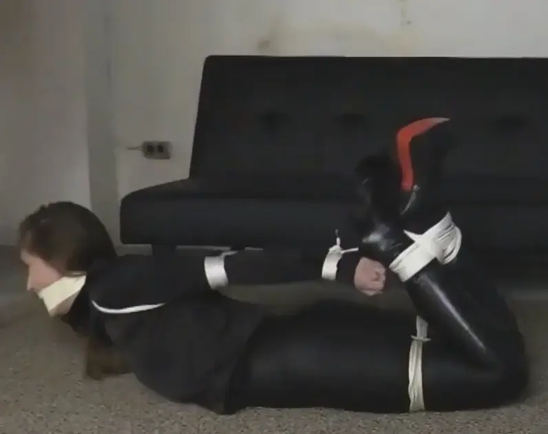 Rachel Adams, Microfoam Tape Gag and Hogtied in Lace Up Knee Boots! 性感的瑞秋被抓获并带回地下室进行束缚训练！幸运的是，她穿着性感的全黑服装。紧身黑色皮裤、黑色真丝纽扣衬衫和令人难以置信的黑色皮革系带高跟厚底及膝靴！瑞秋需要被束缚！<br><br>瑞秋被押送到地下室地牢，嘴巴被堵住，手腕被紧紧绑在身后！她可以随心所欲地反抗，但这个性感的少女将无处可逃！绑架者立即对可怜无助的瑞秋施暴，残忍地将她的手肘绑在一起，她所经受的束缚折磨每分每秒都变得更糟！瑞秋现在完全无助，被按倒在地，绑架者从后面跨在她身上，取下嘴里的口塞，然后用手堵住她的嘴，让她安静地待着，准备下一次用嘴塞住她的嘴！瑞秋只能绝望地看着，她知道接下来会发生什么！一条大手帕紧紧地塞在她的嘴里，她可爱的小嘴被微泡沫胶带紧紧包裹着，让这位美女显得安静又美丽！SEXY RACHEL IS CAPTURED AND BROUGHT BACK TO THE BASEMENT DUNGEON FOR BONDAGE TRAINING! LUCKILY FOR US SHE IS DRESSED IN A SEXY, ALL BLACK OUTFIT. SKINTIGHT, BLACK LEATHER PANTS, BLACK SILK BUTTON DOWN SHIRT AND INCREDIBLE, BLACK LEATHER, LACE UP HIGH HEELED PLATFORM KNEE BOOTS! RACHEL NEEDED TO BE BOUND!<br><br>RACHEL IS ESCORTED INTO THE BASEMENT DUNGEON ALREADY CLEAVE GAGGED AND WITH HER WRISTS TIGHTLY TIED BEHIND HER BACK! SHE CAN BE DEFIANT ALL SHE WANTS BUT THERE WILL BE NO ESCAPE FOR THIS SEXY DAMSEL! HER CAPTOR GOES TO WORK IMMEDIATLEY ON POOR HELPLESS RACHEL, CRUELLY BINDING HER ELBOWS TOGETHER, HER BONDAGE ORDEAL IS GETTING WORSE BY THE SECOND! RACHEL, NOW TOTALLY HELPLESS IS BROUGHT TO HER KNEES, HER CAPTOR STRADLES HER FROM BEHIND, REMOVES THE CLEAVE GAG AND THEN HAND GAGS HER TO KEEP HER NICE AND QUIET AS HE PREPARES HER NEXT MOUTH FILLING GAG! RACHEL CAN DO NOTHING BUT WATCH IN DESPAIR, SHE CAN SEE WHAT IS COMING NEXT! A FULL BANDANA IS TIGHTLY PACKED INTO HER MOUTH AND HER CUTE LITTLE MOUTH IS TIGHTLY WRAPPED WITH MICROFOAM TAPE KRRPING THIS BEAUTY NICE AND QUIET!
