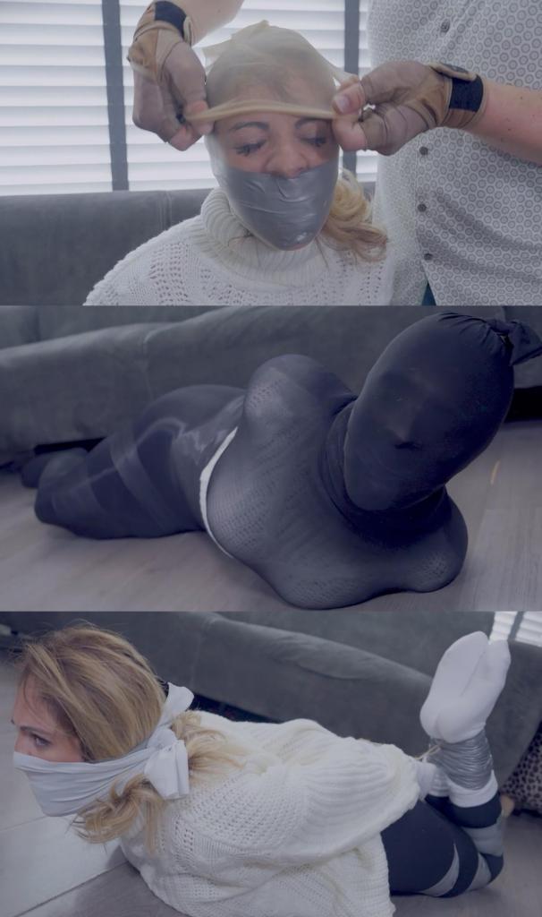 Tape Bound and Helpless: Alba's Bondage Nightmare 阿尔巴以为自己是孤身一人，但她错了。突然间，她被人伏击，用胶带捆绑。她的挣扎很快被用胶带包裹的口塞堵住，让她闷闷不乐，沮丧不已。当她试图挣脱时，她的行动受到限制，她的沮丧感也越来越强烈。但当她被连裤袜蒙住头时，情况变得更糟了，这进一步限制了她的视线和行动……Alba thought she was alone, but she was wrong. Out of nowhere, she's ambushed and restrained with tape bondage. Her struggles are quickly silenced with a duct tape wrap gag, leaving her muffled and frustrated. As she tries to break free, her movements are limited, and her frustration grows. But things take a turn for the worse when she's hooded with pantyhose, further restricting her vision and movement....