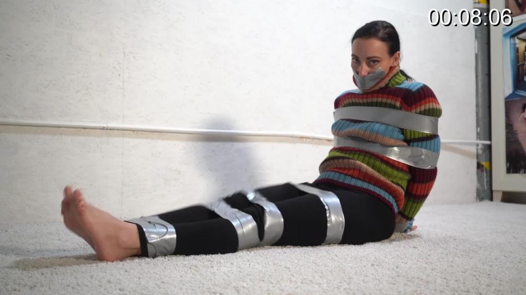 4058 Marie in Barefoot Tape Escape Marie loves a challenge. How about a tape escape challenge. She starts by taping her legs and her mouth, we do the rest. Barefoot and sweater clad, can she escape?