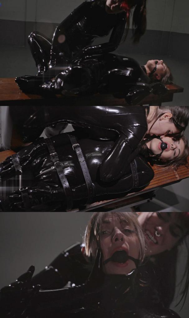 Locked Pleasure 在仓库里，Jade Vivitt 焦急地坐在桌子旁等待她的女主人 Shey，两人都穿着优雅的乳胶紧身衣。Shey 默默地走近，用性感的爱抚和乳胶摩擦的声音挑逗 Jade，她们唯一的交流方式是通过爱抚和眼神。Shey 控制住局面，用皮带绑住 Jade，把她固定在 futomom 的位置，用球形口塞堵住她的嘴，并束缚住她的胳膊和腿。随着 Shey 控制着她的顺从者，挑逗和拒绝的程度不断升级，她一直拉着乳胶拉链，这更增加了她的挫败感，乳胶摩擦的声音加剧了这种情绪。<br><br>Shey 用振动器进一步挑逗 Jade，将它放在她的身体上，然后牢牢地放在她的大腿之间。随着无情的振动占据了主导地位，Jade 压抑的呻吟声充满了整个空间。振动器不停地工作，Shey 按摩着 Jade 穿着乳胶的脚，她按摩和爱抚着这些脚，享受着每一次控制。<br><br>Shey 对自己的工作感到满意，她用皮带把 Jade Vivitt 的每一寸身体都绑成木乃伊，而振动器则继续挑逗着一波波的[X_X]。Jade 孤身一人，无助地被束缚着，屈服于女主人的控制，一次又一次地体验真正的[X_X]，她无法逃脱。In a warehouse, Jade Vivitt waits anxiously on a table for her Mistress Shey, both dressed in an elegant latex catsuit. Shey approaches silently, teasing Jade with sensual caresses and the sound of latex rubbing, their only communication is through caresses and glances. Taking control, Shey binds Jade with leather straps, securing her in futomom position, gagging her with a ball gag and restraining her arms and legs. The teasing and denial escalates as Shey dominates her submissive, keeping the latex zipper closed to add to the frustration, the sound of latex rubbing intensifying the mood.<br><br>With a vibrator, Shey teases Jade further, running it over her body before placing it firmly between her thighs. Jade's stifled moans fill the space as the relentless vibrations take over. As the vibrator works relentlessly, Shey massages Jade's latex covered feet which she massages and caresses, savoring the control at every turn.<br><br>Satisfied with her work, Shey leaves Jade Vivitt mummified with leather straps every inch of her body, as the vibrator continues to tease waves of pleasure. Alone and helplessly restrained, Jade succumbs to her Mistress's control, experiencing true orgasms, one after another, from which she cannot escape.