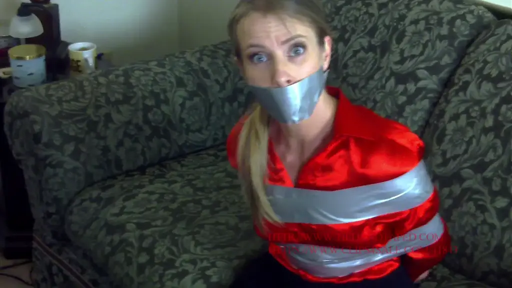Claire Irons - Secretary Claire Tape Tied Good help is so hard to find. Claire Irons is the latest in a long, long line of lazy secretaries I hired that won't do the most basic job functions: getting me coffee and letting me chase her around the desk. At least she looked hot in her red satin blouse. All the same, I can't tolerate such laziness, so I punish her by taping her up tightly. Tape is wrapped around her wrists, just below her breasts, ankles, and knees and her mouth is well taped. Maybe a day like this will convince her to get me a decent cup of coffee!