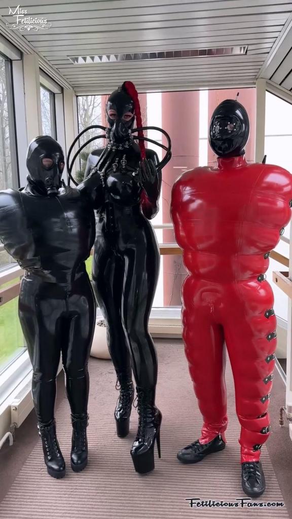 Heavy rubber at EFM 2023 The Easter Fetish Meeting in Essen is always a great chance to wear the most crazy and bizarre outfits. This is where you can go over the top and show off your best outfits.<br>I really like this event because it's a hotel takeover, so there are no vanilla people in the hotel. It's so unique!<br>I've put my husband in our inflatable catsuit and hood by Demask, and put my friend Rubber Emily in our inflatable cover all top (also by Demask). I took both of them for a walk around in the hotel. I also changed my outfit halfway and in the evening we went out for dinner in the city. Of course also in latex.
