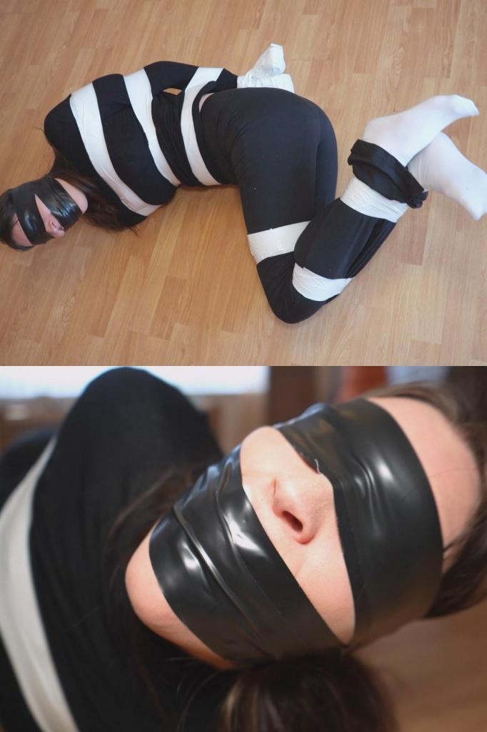 Tying up and gagging my step auntie claire, taped up and sock gagged (mp4) 克莱尔突然过来看望她的继侄子，他因为身体不舒服，已经在家里呆了几天了。他一直感到沮丧和抑郁，继姑克莱尔过来逗他玩，她知道他需要什么。她穿着黑色高领毛衣和黑色喇叭形瑜伽裤，还穿着白色短袜，因为她知道他喜欢她这样穿。她还知道他喜欢束缚，她给了他一个惊喜，给了他几卷 PVC 和胶带。然后她建议他们玩得开心，并让他把她绑起来。接下来我们看到继姑克莱尔被胶带绑住了。她的躯干、手臂、手腕、腿和脚踝都缠上了胶带。他甚至不惜用胶带把她的手绑成一个球，这样她就无法撕开胶带了。她挣扎了一会儿，然后她建议用更多的胶带堵住她的嘴，让她闭上嘴。不幸的是，继母克莱尔认为他不会用她包里那双汗臭的袜子。他把它们塞进克莱尔的嘴里，并像承诺的那样，用紧紧缠绕的胶带堵住嘴。克莱尔再次在地上扭动和挣扎，然后他最后一次回来，给她戴上了一个 PVC 胶带眼罩Claire has popped over to see her step nephew who has been house bound for a few days due to not feeling well. He's been feeling fer down and depressed and step auntie claire has gone over to entertain him and she knows exactly what he needs. She turns up in her black turtle neck and flared black yoga pants, she's also wearing some white ankle socks as she knows he likes it when she dresses like this. She also knows he loves bondage and she surprises h8m with a couple roles of pvc and duct tape. She then suggest they have some fun and asks him to tie her up. We next see step auntie clair all trussed up in tape. Her torso, arms, wrists, legs and ankles all taped up. He has even gone to the lengths of taping her hands up in a ball so she can't pick at the tape. She's left to struggle for a while before she suggests gagging her real good by stuffing her mouth and sealing it in with more tape. Unfortunately for step auntie clair she didn't think he would use a pair of sweaty smelly socks from her bag. He stuffs them in claires mouth and as promised he seals them in with a good tight wrap around tape gag. Claire is again left to writh and struggle on the floor before he returns a last time and gives her a pvc tape blindfold