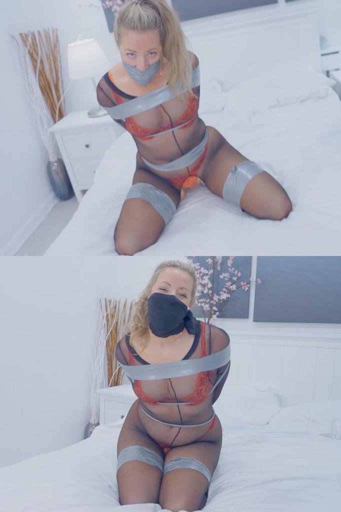 Bound and Gagged: Bri's Tape and Bodystocking Fantasy Bri looks at you with anticipation, her eyes shining with excitement and a hint of challenge. "Are you going to give it to me?" she asks, her voice laced with desire. She wants to feel the constraint, the tightness of tape binding her while she's encased in a smooth pantyhose bodystocking. You oblige, ready to fulfill her fantasy. She lies on the bed, her body already hugged tightly by the pantyhose...