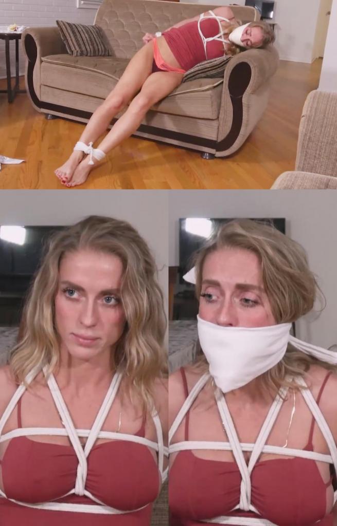 Buff Blondie - I Could Beat You with an Arm Tied Behind My Back 和金发女郎一起玩的时候，扎恩思考着男人和女人之间的力量差异。他问她，作为一个肌肉发达、身材匀称的女人，在打架时能不能打败他这个身材走样的男人。金发女郎说，即使她的一只胳膊被绑在身后，她也能打败他。她说得如此自信，扎恩建议他们来测试一下。扎恩说他不确定她哪只胳膊最有力，所以他建议把她的两只胳膊都绑在身后，让她挣扎，然后再把更强壮的胳膊绑在身后。绑好它们后，他确定她无法逃脱，就抓起更多的绳子绑住她的脚踝，然后加上胸背带。这不是交易的一部分。他无视她，把两条女式手帕塞进她的嘴里，在她的嘴唇上系了一块厚厚的白布，说这是为了防止她咬他。他挠了挠被绑住并捂住嘴的金发女郎一会儿，然后离开去拿别的东西让她安静下来。金发女郎奋力挣扎，但当他回来时，她仍然被牢牢地绑着。在下一个口塞中，他将一条粉色围巾塞进她的嘴里，并在她的牙齿之间系了一条白色头巾。看着她继续挣扎，裙子被掀起露出内裤，扎恩知道这个口塞不会持续太久。为了解决这个问题，他用一条大尼龙内裤塞住她的嘴，并用 2 英寸厚的微泡沫胶带缠住她的嘴唇，使口塞更加牢固。在压住她并宣布胜利后，他让金发女郎挣扎。不过，他可能在几个小时后放她走。金发女郎真的不应该让他这么轻易地把她的手腕绑在身后。While hanging out with Blondie, Zahn ponders the strength differences between men and women. He asks if she, as a muscular, in-shape woman, could beat him, an out-of-shape man, in a fight. Blondie says she could take him even if she had one of her arms tied behind her back. She says it so confidently, Zahn suggests they put it to the test. Zahn says he isn’t sure which of her arms is strongest so he suggests tying both behind her back, letting her struggle, and then tying the stronger arm behind her. Once he has them bound and is sure she can’t escape, he grabs more rope and ties her ankles, then adds a chest harness. This isn’t part of the deal. Ignoring her, he stuffs 2 womens hankies in her mouth and ties a thick white cloth over her lips, saying it’s to keep her from biting him. He tickles the bound and muffled Blondie for a bit and then leaves to get something else to quiet her with. Blondie puts up a struggle but she’s still securely tied when he returns. For the next gag, he crams a pink scarf in her mouth and ties a white bandana between her teeth. Watching her continued struggles, her dress riding up to expose her panties, Zahn can tell the gag isn’t going to hold for long. To remedy that, he fills her mouth with a big pair of nylon panties and wraps 2-inch microfoam tape over her lips, creating a much more secure gag. After pinning her and claiming victory, he leaves Blondie to struggle. He’ll probably let her go in a few hours, though. Blondie really shouldn’t have let him tie her wrists behind her back so easily.