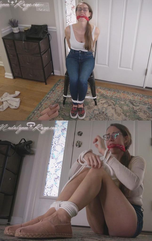 Madalynn gets dressed for the sorority initiation 玛达琳穿着粉色平底鞋、短牛仔裙和薄罗纹毛衣来到姐妹会会所。周围空无一人，她查看手机，想知道大家都在哪里。她放下东西，在屋子里四处走动，等待着。<br><br>她听到一个声音，大叫一声，然后开始上楼，在那里她遇到了一群戴着面具的女孩。她问这是不是个骗局，非常害怕。她们要求玛达琳打开包，她勉强答应了。<br>她拿出一根绳子和一条头巾，然后被指示将自己绑在地上。<br>这不是她期待的入会仪式，她们用一些私人照片来戏弄她，她顺从了。坐在地上，她们告诉她绑住脚踝、手腕和胸部。头巾塞进她的嘴里，先塞进去。玛达琳服从命令，把打结的塞口布塞进嘴里，紧紧地绑住。一些头发被打结缠住了，她不禁皱了皱眉。<br>她给自己戴上胸背带，然后是脚踝，然后用塞口布要求他们帮忙绑住手腕。<br>玛达琳扭动着身体，挣扎着，双腿高高翘起，裙子翘起，塞口布里传来抱怨声。她试图拉下牛仔裙，但太短了！<br><br>经过一段时间的挣扎，他们解开了她的绳子，递给她一些新衣服，让她坐下。<br>他们命令她脱衣服换衣服，她服从了。<br>她穿上白色紧身衣背心、牛仔裤和平底红鞋。他们告诉她，她现在的装扮不适合他们要带她去森林深处的地方。<br>玛达琳一边抗议，一边让大家知道他们有多糟糕，同时拉起她的紧身牛仔裤，穿上鞋子。<br><br>他们厌倦了听玛达琳抱怨，所以他们把她绑起来，把打结的口塞头巾放回她的嘴里，让她等待运输人员的到来。Madalynn arrives at the sorority house in her pink flats, short denim skirt and thin ribbed sweater. No one Is around and she checks her phone wondering where everyone is. She puts her stuff down and wanders around the house a little bit waiting.<br><br><br><br>She hears a noise and calls out, and starts to go up the stairs where she’s met with a group of girls in masks. She asks if it’s a trick, and is very scared.  They demand that Madalynn opens the bag and  she reluctantly agrees.<br>She pulls out a bunch of rope and a bandana and is then instructed to tie herself up on the ground.<br>This isn’t the initiation she expected, they tease her with some personal photos and she complies. Sitting down on the ground, they tell her to tie her ankles, wrists, and chest. The bandana goes in her mouth, and that goes in first. Madalynn obeys the orders and puts the knotted cleave bandana gag into her mouth and ties it tightly. Getting some hair caught in the knot and wincing.<br>She puts a chest harness on herself, then her ankles, and then asks, in gag talk, to help with her wrists.<br>Madalynn wiggles and struggles with her legs in the air, showing off up her skirt, and bitching through her cleave gag.  She tries to pull down her jean skirt but it’s just too short! <br><br>After a while of struggling they untie her and hand her some new clothes and tell her to sit down.<br>She’s ordered to strip and change and she obeys.<br>She puts on the white leotard tank top, jeans and flat red shoes.  They tell her her current outfit isn’t suitable for where they’re going to take her deep into the woods.<br>Madalynn protests and lets the group know how badly they suck while pulling up her skin tight jeans and putting on her shoes.<br><br>they’re sick of hearing Madalynn bitch, so they tie her back up and put the knotted cleave gag bandana back in her mouth while she waits for the transport crew to arrive.