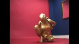 Alex adams tied in golden zentai Alex adams frogtied in golden zentai