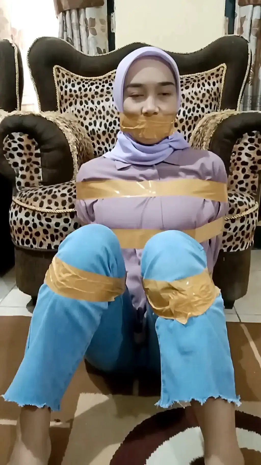 Indonesian Girl Held Hostage with Duct Tape Indonesian girl held captive in kidnapper's house with duct tape restraining her body