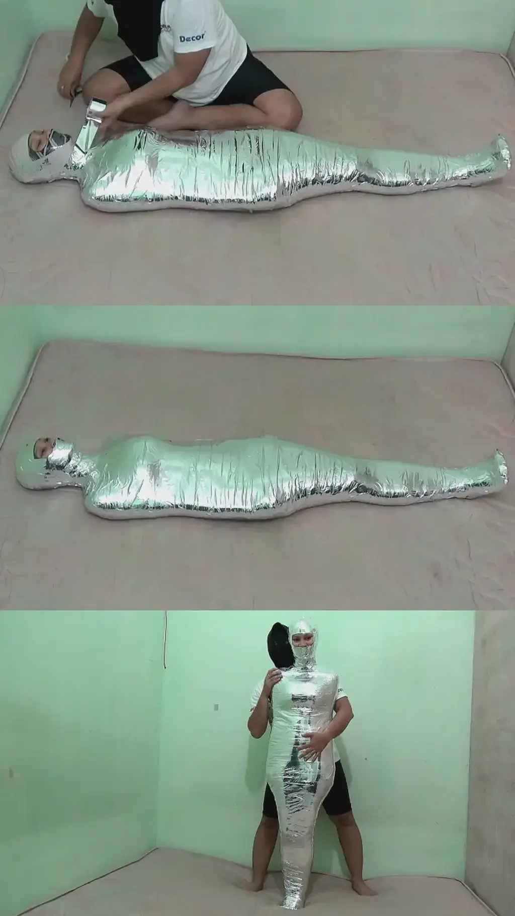 [POV] Main Scene Of RandyMummify RM112 A beautiful girl is mummified in the bedroom with her eyes open.<br>This girl's body is tightly wrapped with 2 different types of tapes. first the body was wrapped in white duct tape and then tightened with chrome duct tape.<br>After being helpless, this girl was picked up and played with until this girl struggled to ask to be released