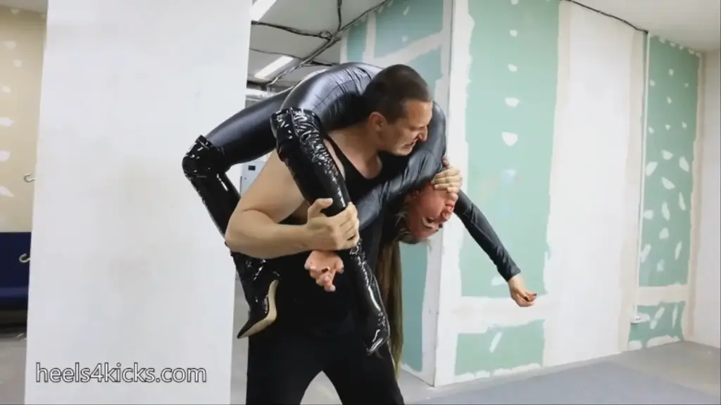 Unexpected loss of Melanie the same leather catsuit without the mask and our superheroine melanie hair in a bun, but also wearing high black leather boots. I want her to fight against the strongest and biggest male anatgonist possible