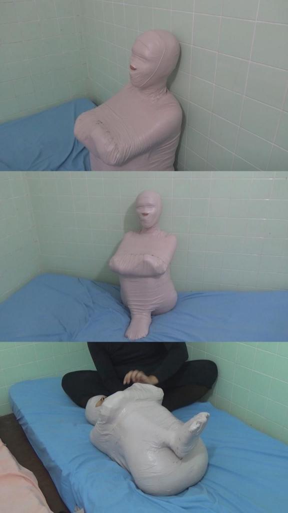 [POV] Main Scene Of RandyMummify RM125 A cute girl is tightly mummified in a sitting pose. This pose is an uncomfortable pose because it will feel tight. With this pose, the slave will never be able to break free because moving just a little is difficult.