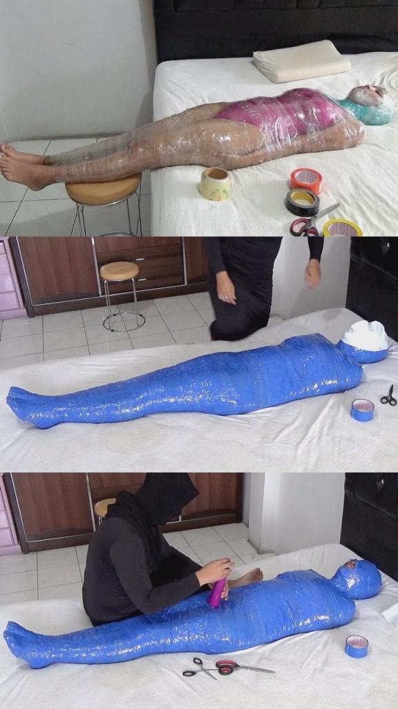 [POV] Main Scene Of RandyMummify RM130 A beautiful girl is mummified on a bed in a hotel bedroom. The body of this beautiful girl is wrapped in 2 layers of tape, the first layer uses transparent duct tape and the second layer uses blue duct tape. After this girl's body was powerless, this girl was given stimulation with a vibrator on her vagina.