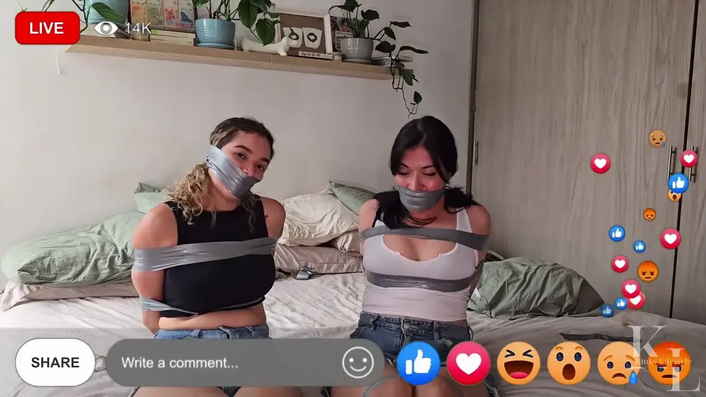 Simona &amp; Luana Tape Each Other Up by Their Audience Request Luana is preparing her bondage stream, today she's following what her audience ask her. She invites Simona and get you to choose between PVC tape or Duct tape, you choose PVC for body and Duct tape for mouth, so they do so. After Luana's all taped up, Simona removes both Duct Tape gags, to apply a tight PVC wrapgag on both of them.<br><br>Next we see is both girls streaming playfully as they're taped up, tightly wrapgagged gag talking all the way, rubing their soft skin against the bed, feeling the tape to the maximum until the stream ends