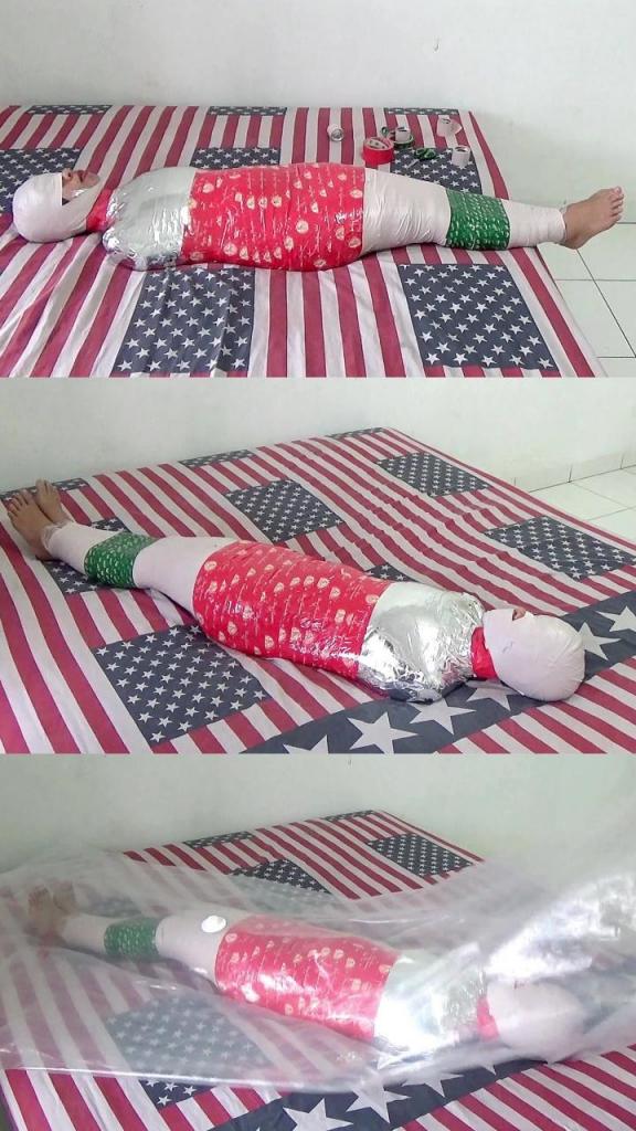 [POV] Main Scene Of RandyMummify RM140 A girl wrapped into a mummy in a hotel room. This girl’s body is tightly wrapped with 2 layers of duct tape but 3 different types of duct tape. After being wrapped helplessly, this girl’s body was about to be vacuumed with plastic but this girl screamed hysterically