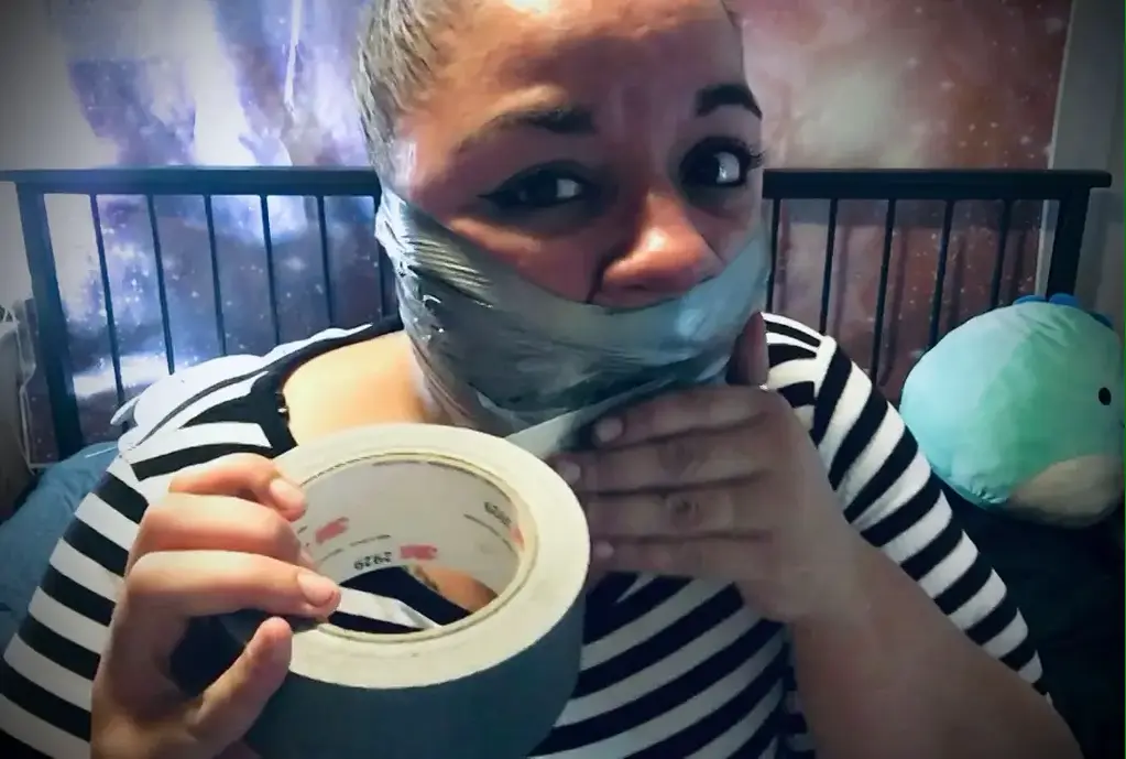 Wrapped tightly for you Throwback video: In a playful mood I open my mouth wide and cleave gag myself with duct tape. I continued to wrap and wrap the tape up to my nose and down to my chin. Once my gag is nice and wide I enjoy myself and run my body all over having a nice evening with my gag.