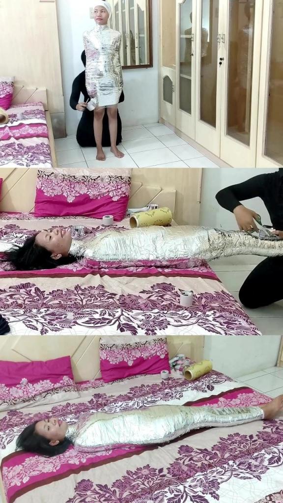 [POV] Main Scene Of RandyMummify RM141 A girl tries to be mummified with chrome duct tape. This girl was wrapped in front of friends. There was no special scene beside this girl's feet being tickled