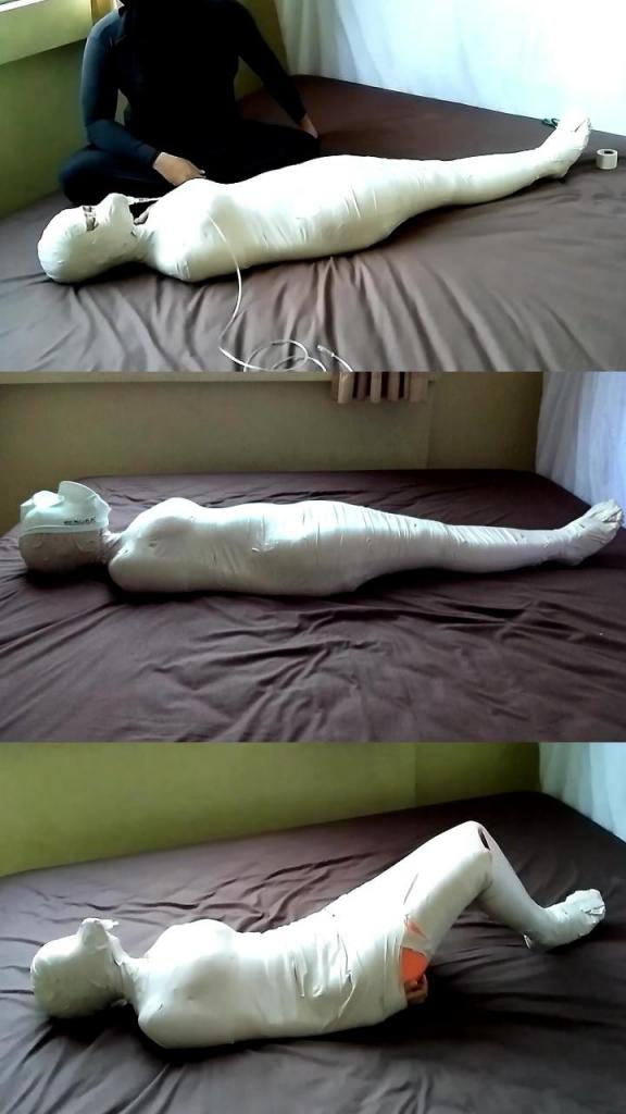 [POV] Main Scene Of RandyMummify RM142 One girl was quarantined with her body wrapped tightly in mummification. The girl's body was completely wrapped and breathed only using the tube from the oxygen mask. Not enough with that, this girl was tortured by having her breath hole closed and her head covered with a swimcap